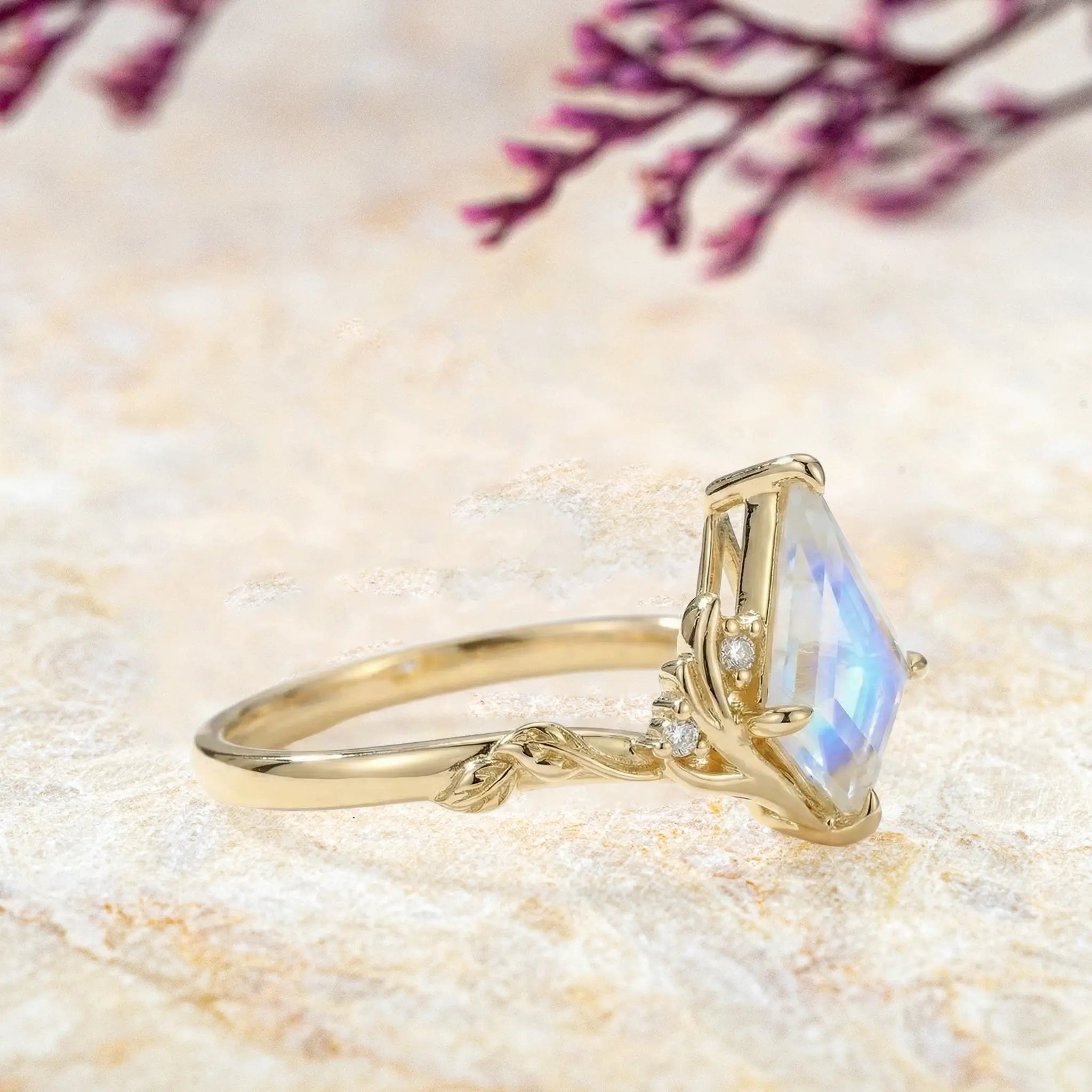 Side profile of moonstone engagement ring highlighting antler claws and moissanite accents