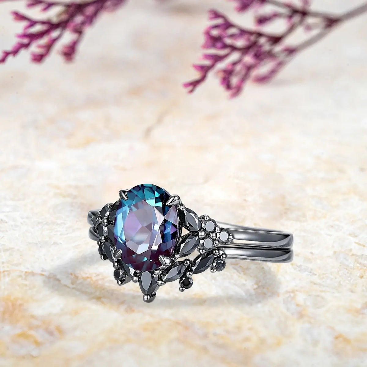 Side view of oval alexandrite ring showing black onyx marquise cluster design and curved chevron wedding band profile