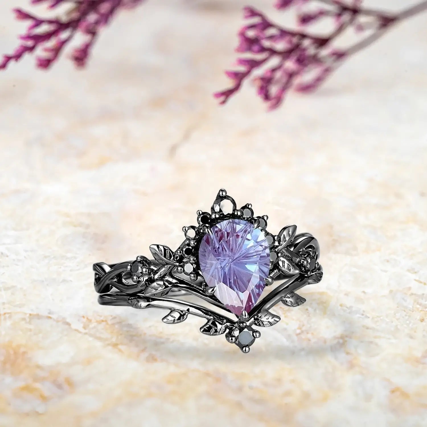 Side view of pear alexandrite fireworks ring showing Gothic half halo crown and curved leaf wedding band profile