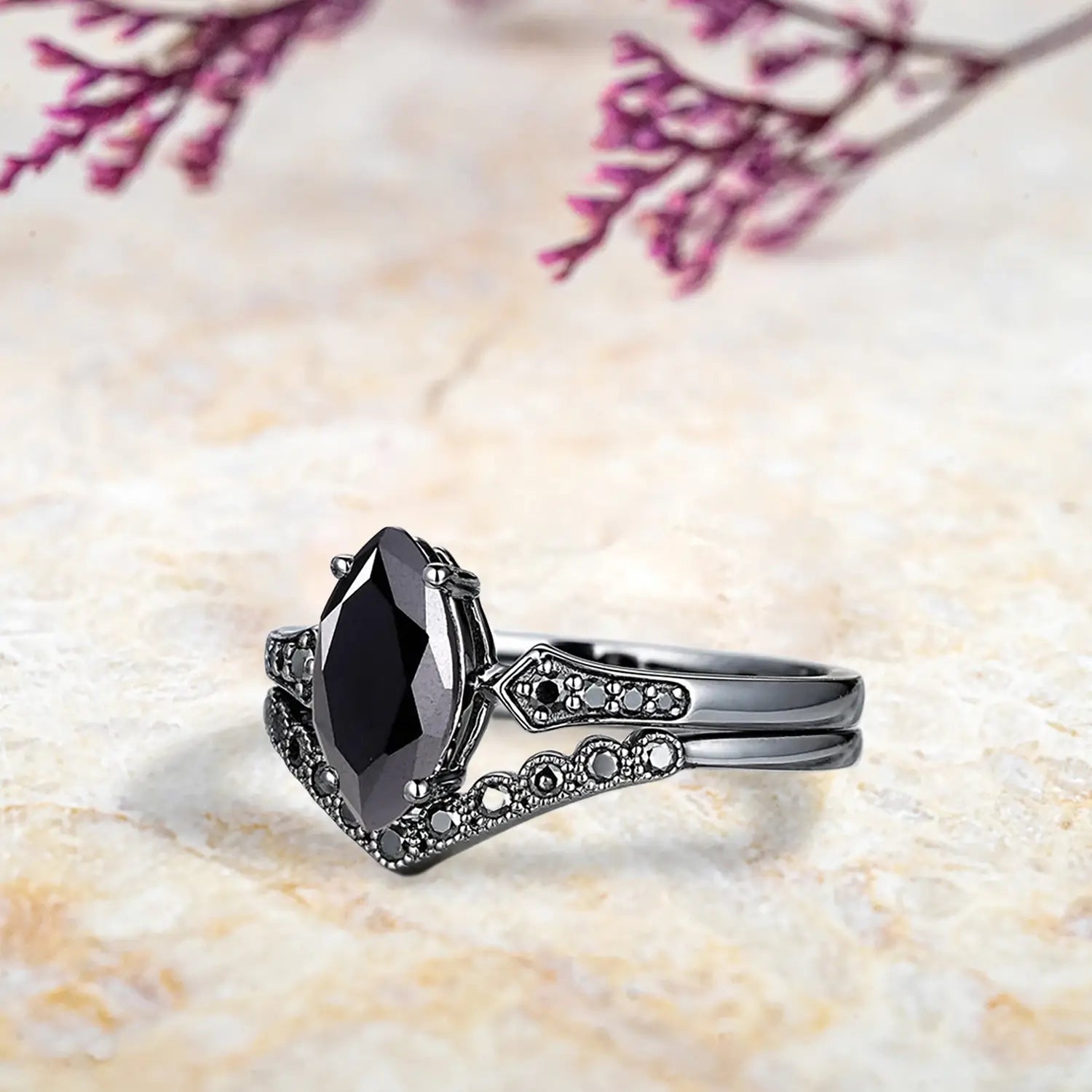 Side view of marquise black onyx ring showing vintage milgrain detail and curved chevron wedding band profile
