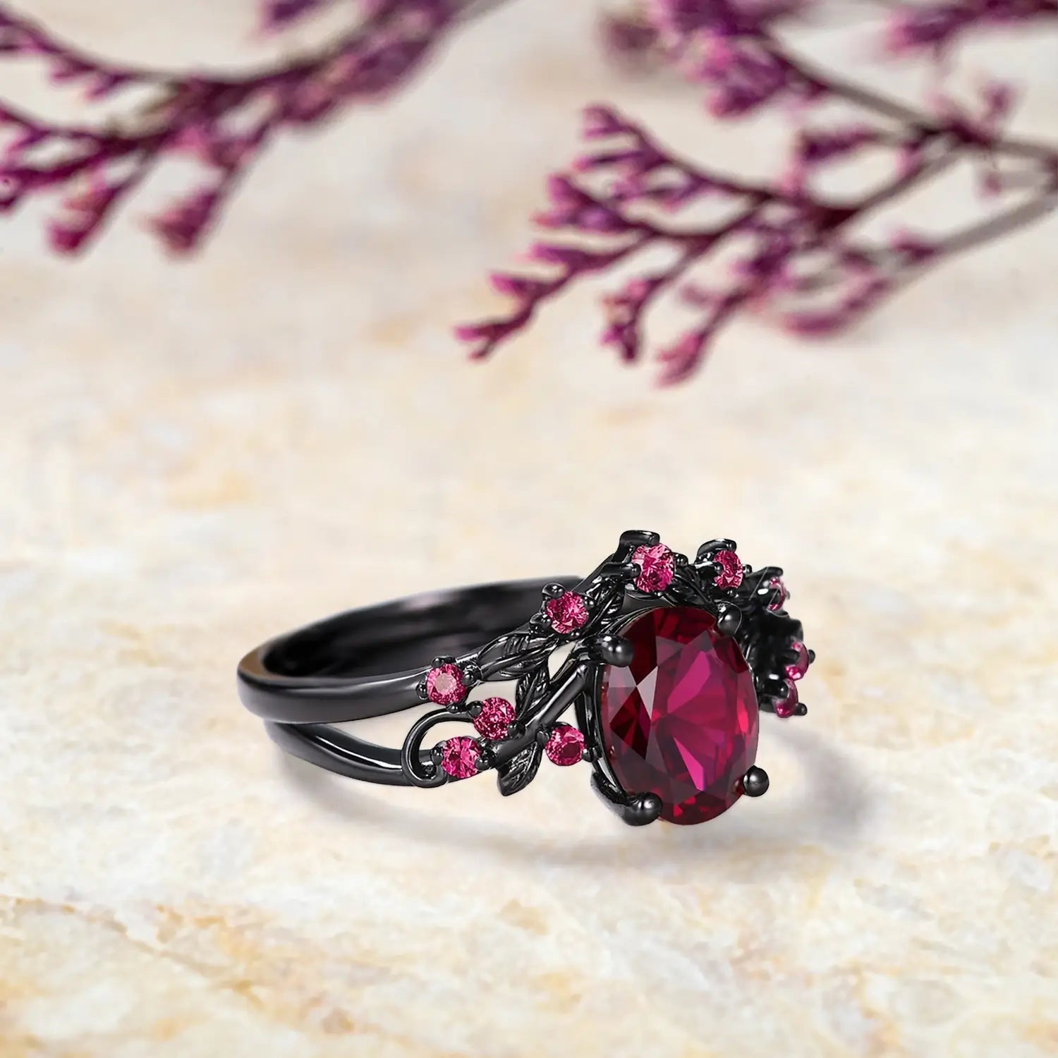 Side view of oval ruby engagement ring set showing leaf details and curved wedding band profile