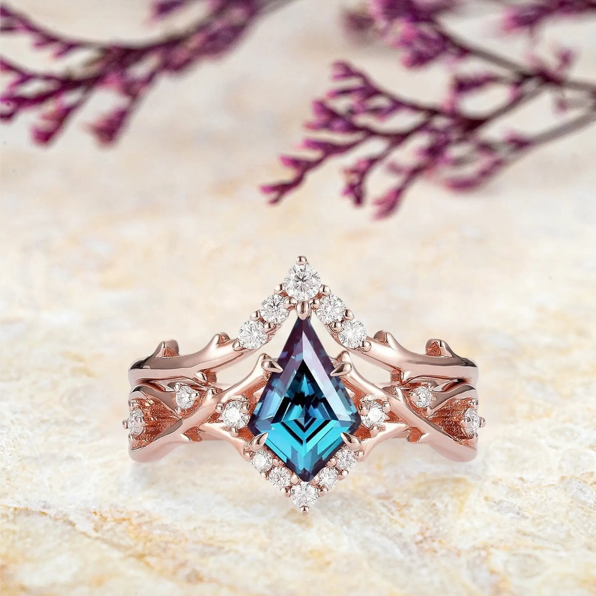 Kite cut alexandrite engagement ring with branch halo and gold band