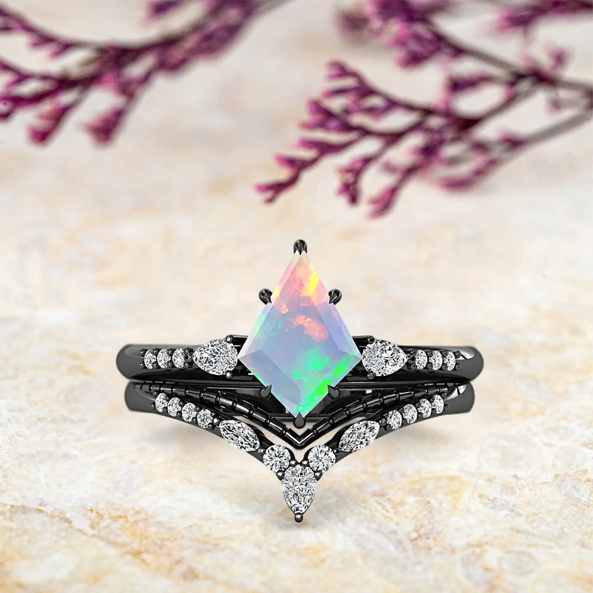 Kite opal engagement ring with rainbow colors and double chevron wedding bands set in black rhodium art deco design