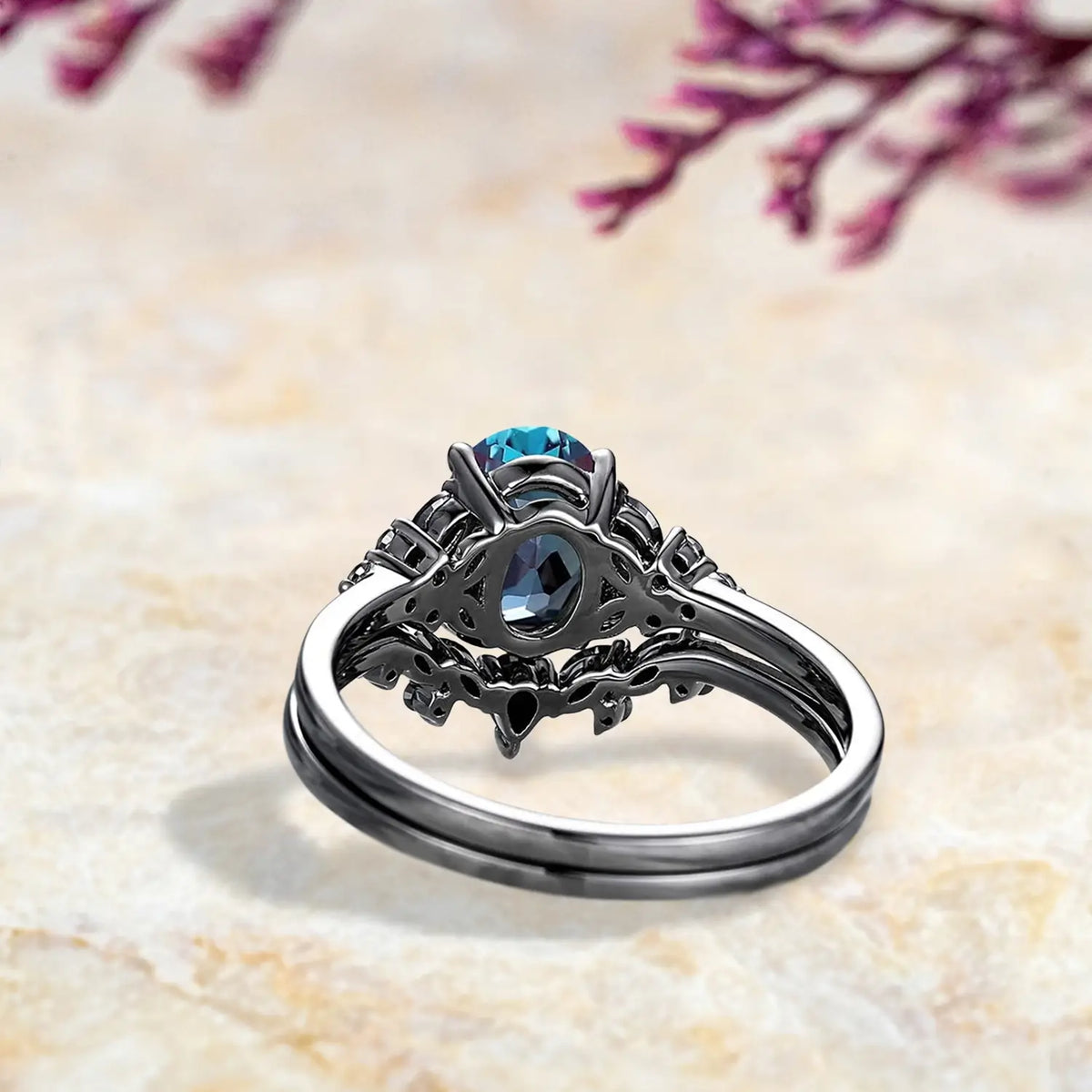 Back view of luxury alexandrite engagement ring set showing Gothic cluster and chevron wedding band craftsmanship in black gold