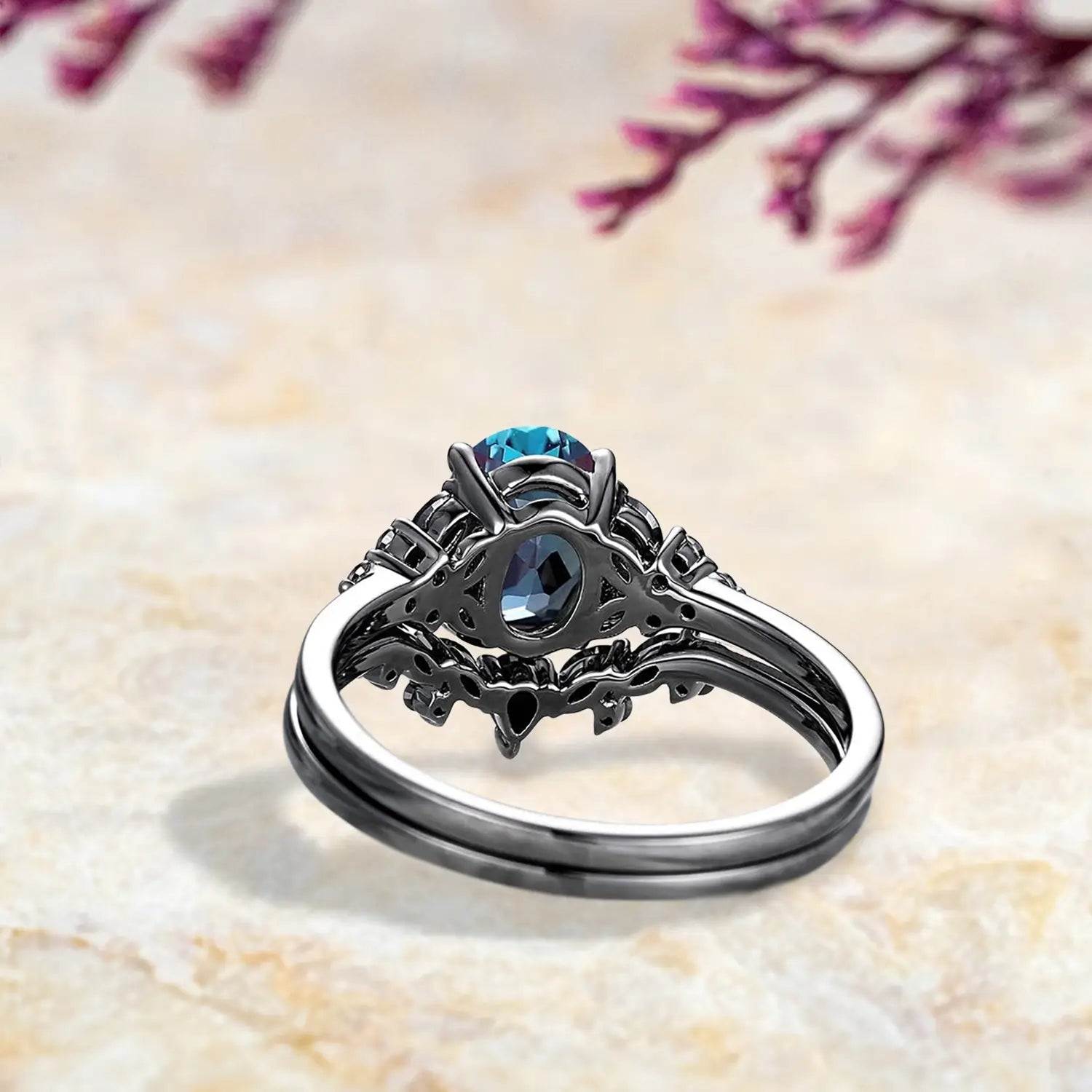 Back view of luxury alexandrite engagement ring set showing Gothic cluster and chevron wedding band craftsmanship in black gold