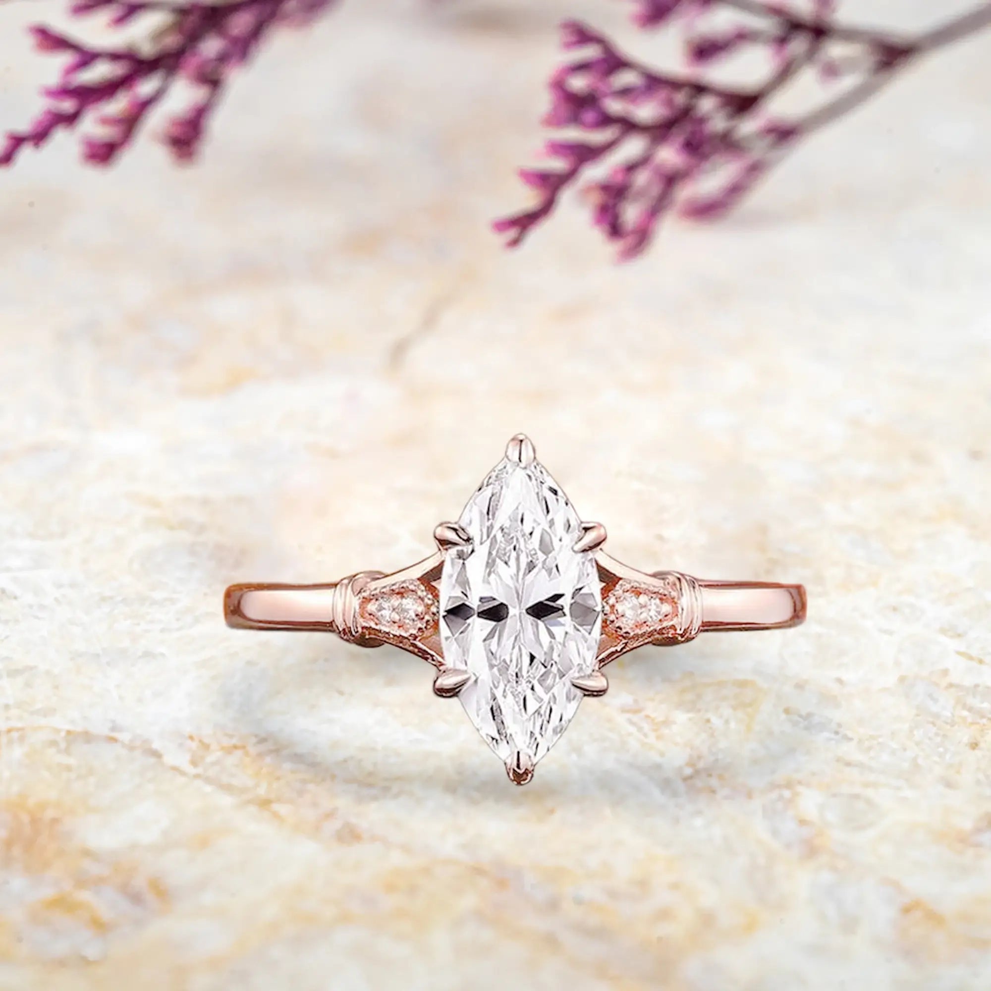 Marquise moissanite engagement ring with pear accents on vintage split shank rose gold band orleone