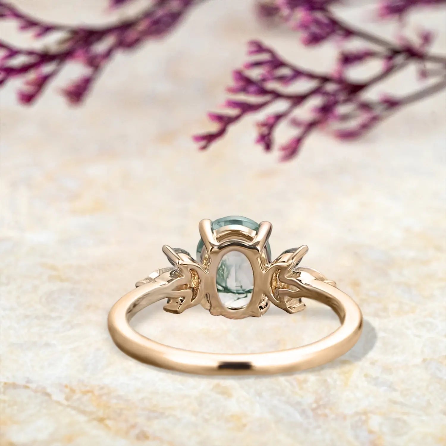 Back view of moss agate engagement ring showing rose gold band and setting structure