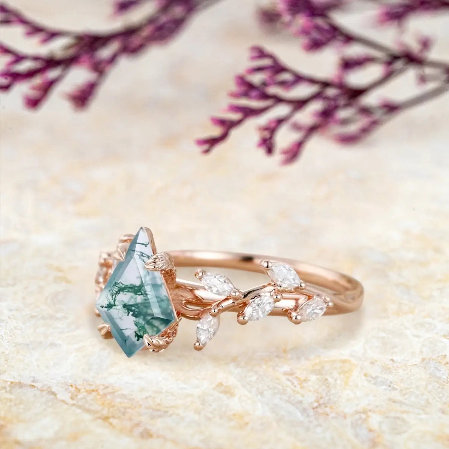 Side view of moss agate ring showing rose gold leaf clusters and marquise stones