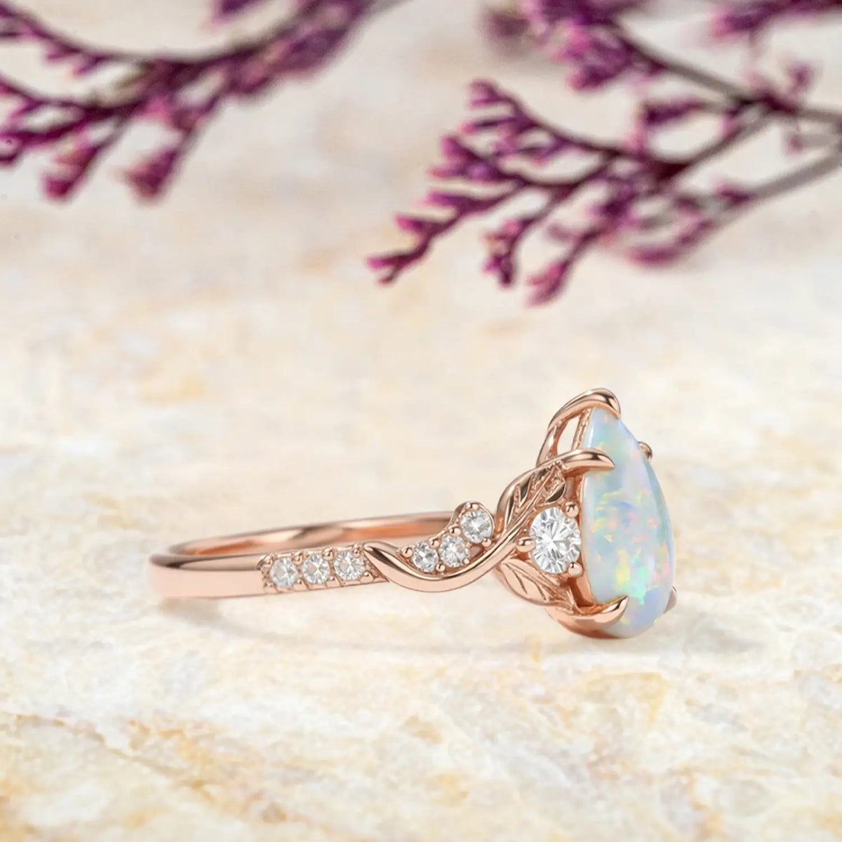 vintage opal engagement ring with leaf band and moissanite accents