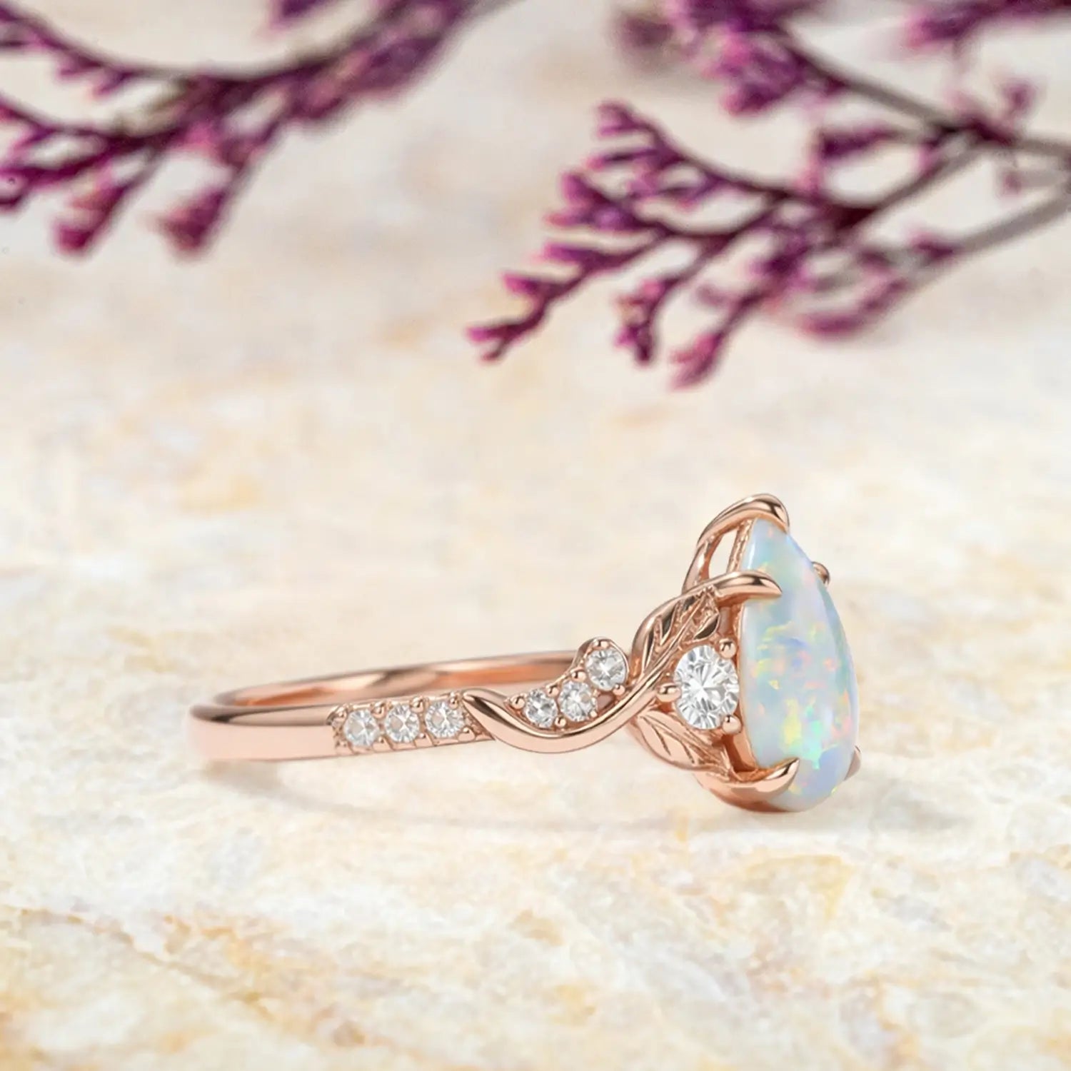 vintage opal engagement ring with leaf band and moissanite accents