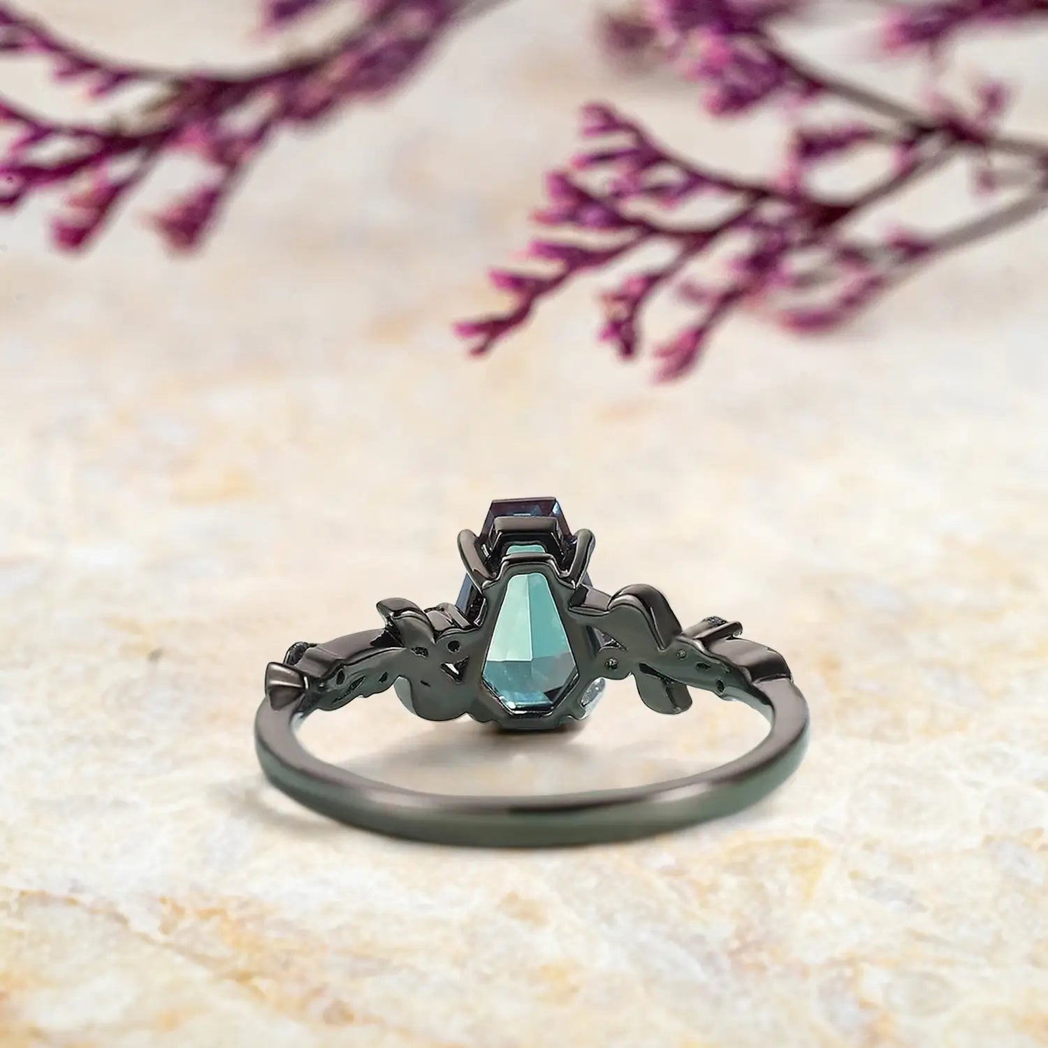 Back view of gothic alexandrite engagement ring showing nature inspired leaf band craftsmanship in black gold