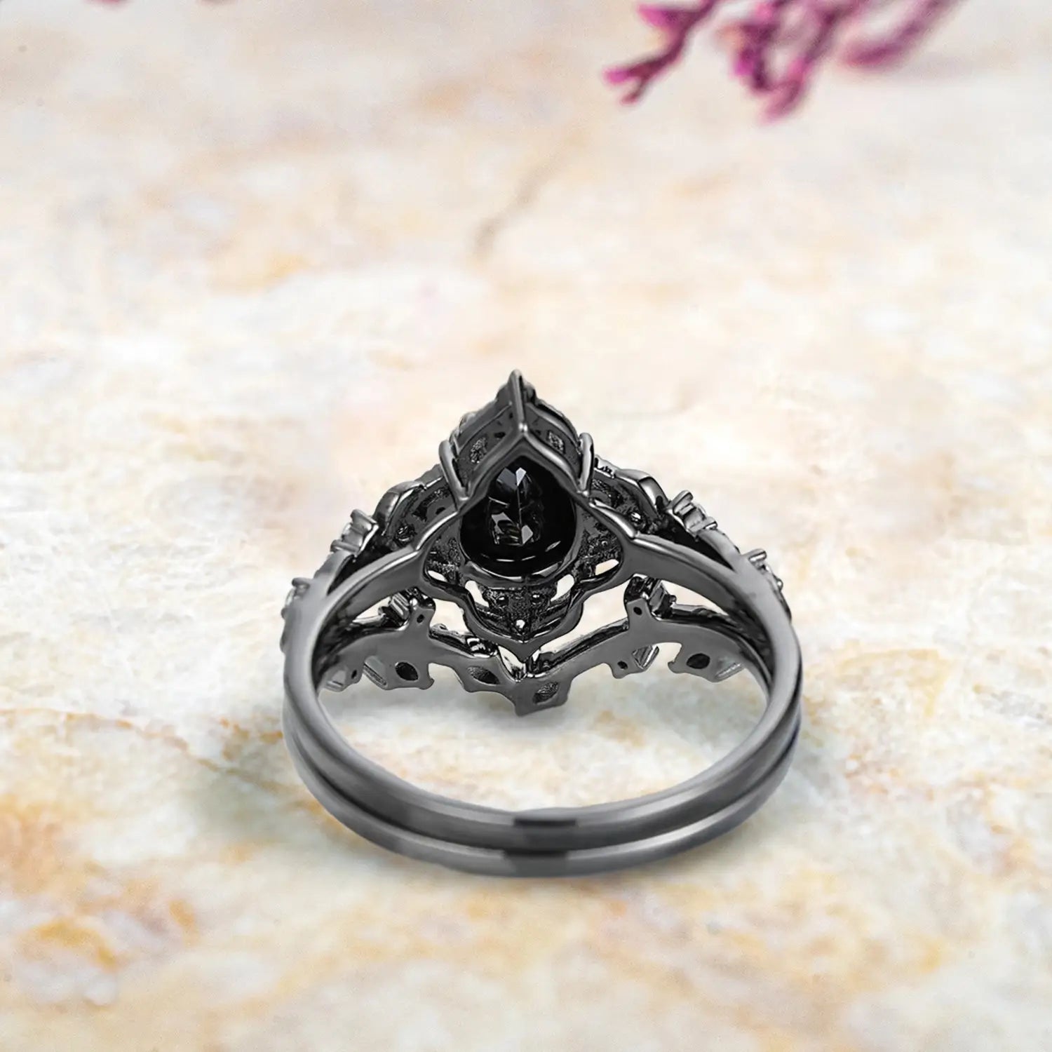 Back view of luxury black onyx engagement ring set showing nature inspired leaf crown milgrain and chevron band craftsmanship