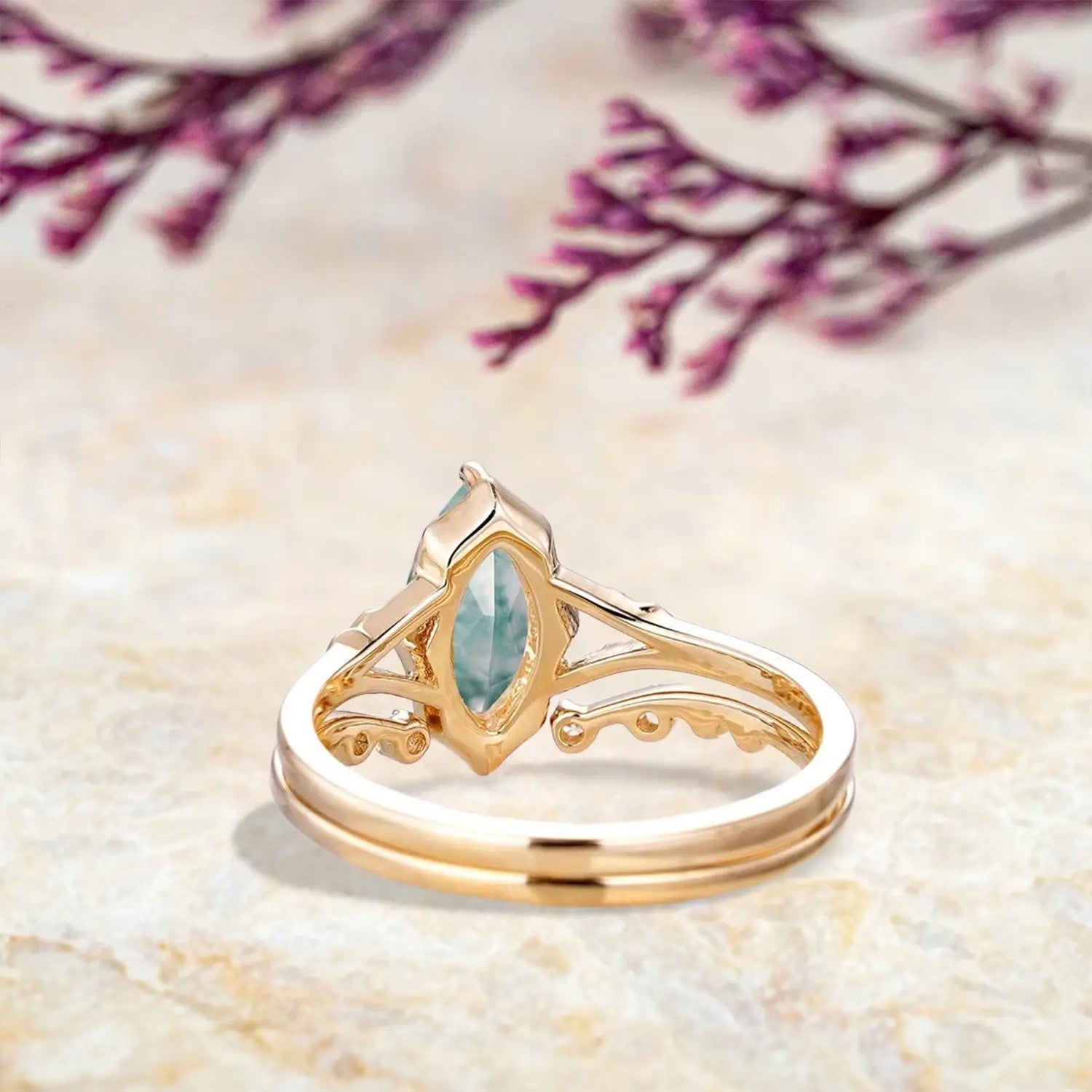 Back view of vintage moss agate engagement ring set showing split shank and open curved wedding band craftsmanship in yellow gold