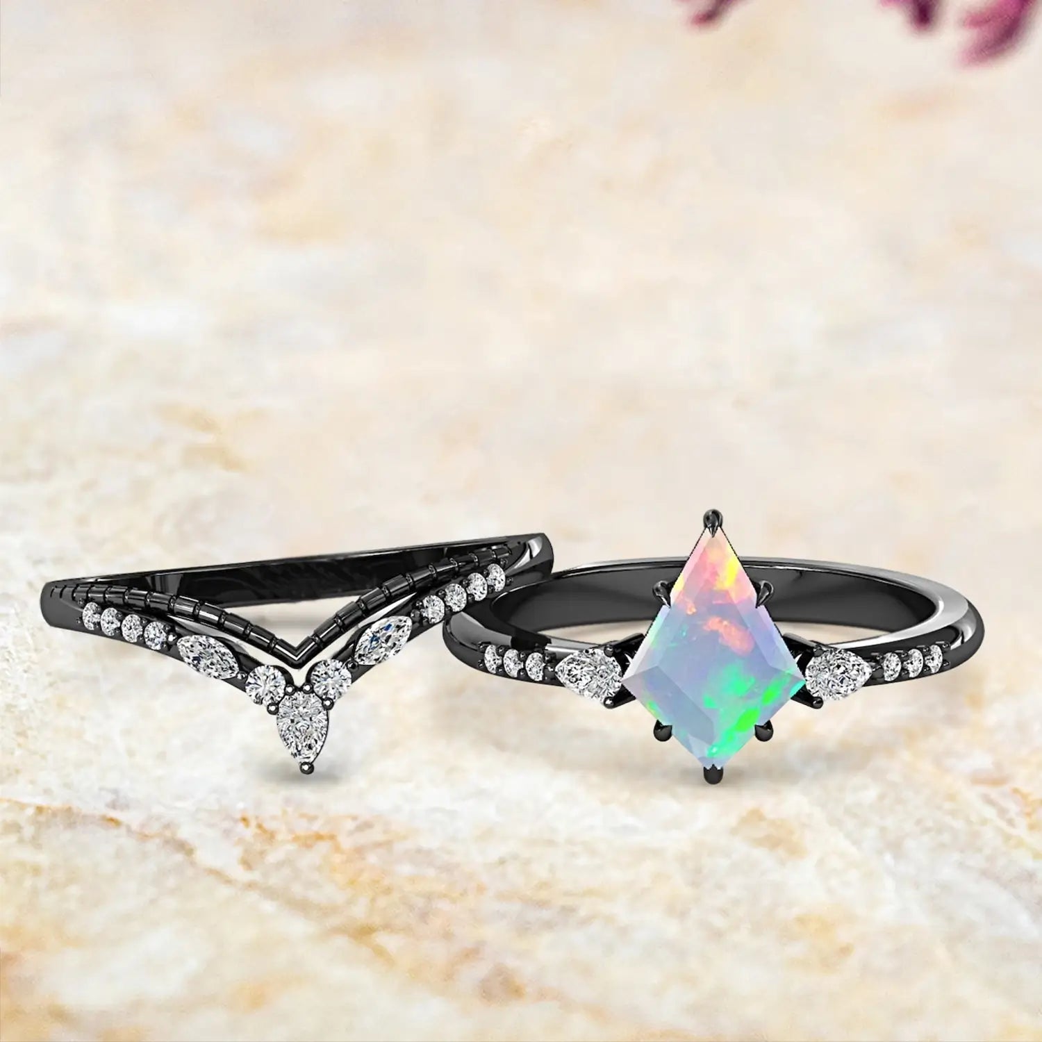 Kite opal art deco engagement ring and double chevron wedding bands displayed separately showing October birthstone luxury bridal set