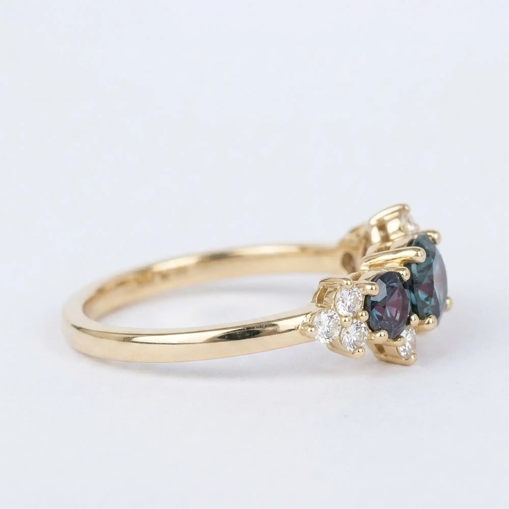 Angled side view of Aeloria geometric engagement ring showing secure prong alignment and band durability