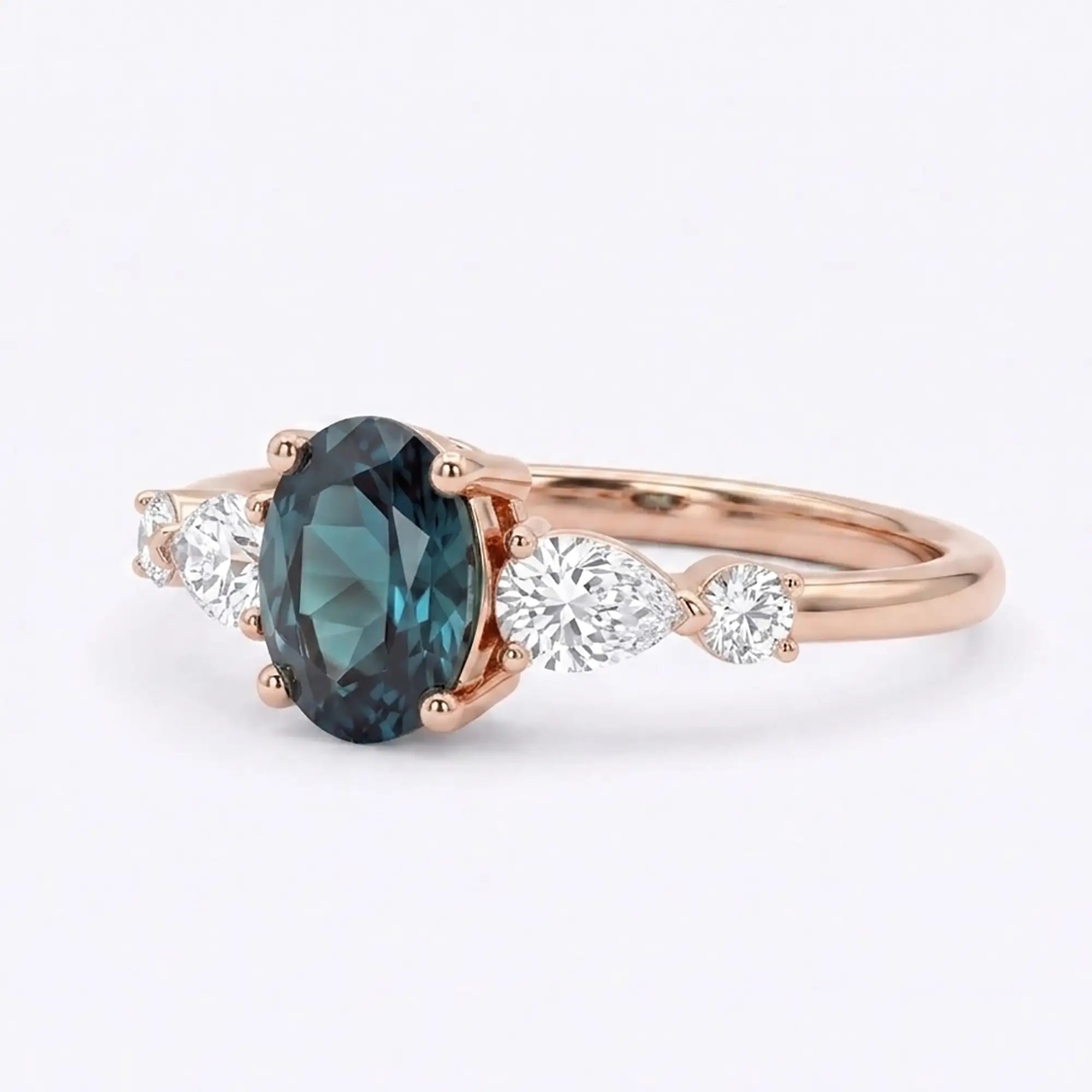 Side view of a thin gold alexandrite ring band showing low-profile prong work and secure gemstone placement