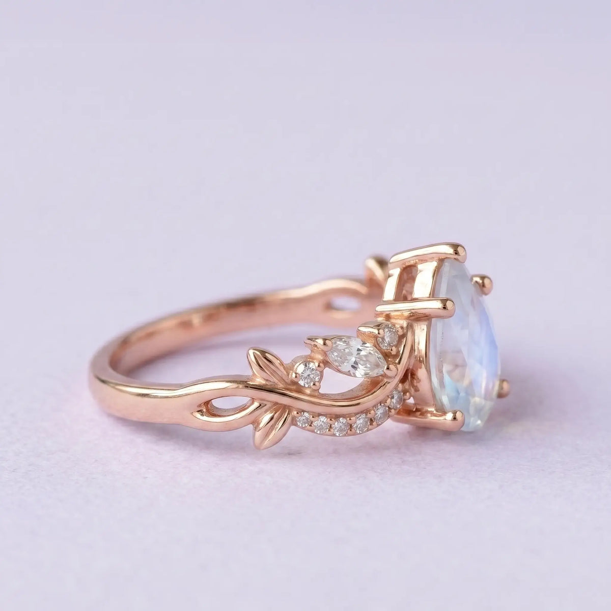 Unique alternative bridal moonstone ring with intricate leaf details and split shank in solid gold