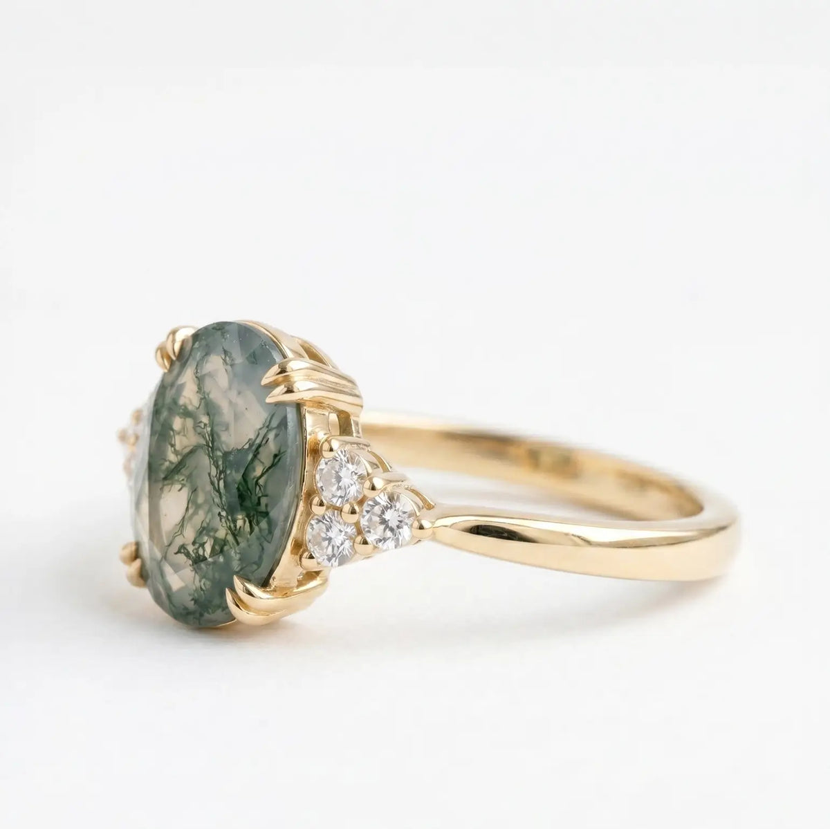 Unique alternative bridal gemstone ring with round side stones in solid K gold