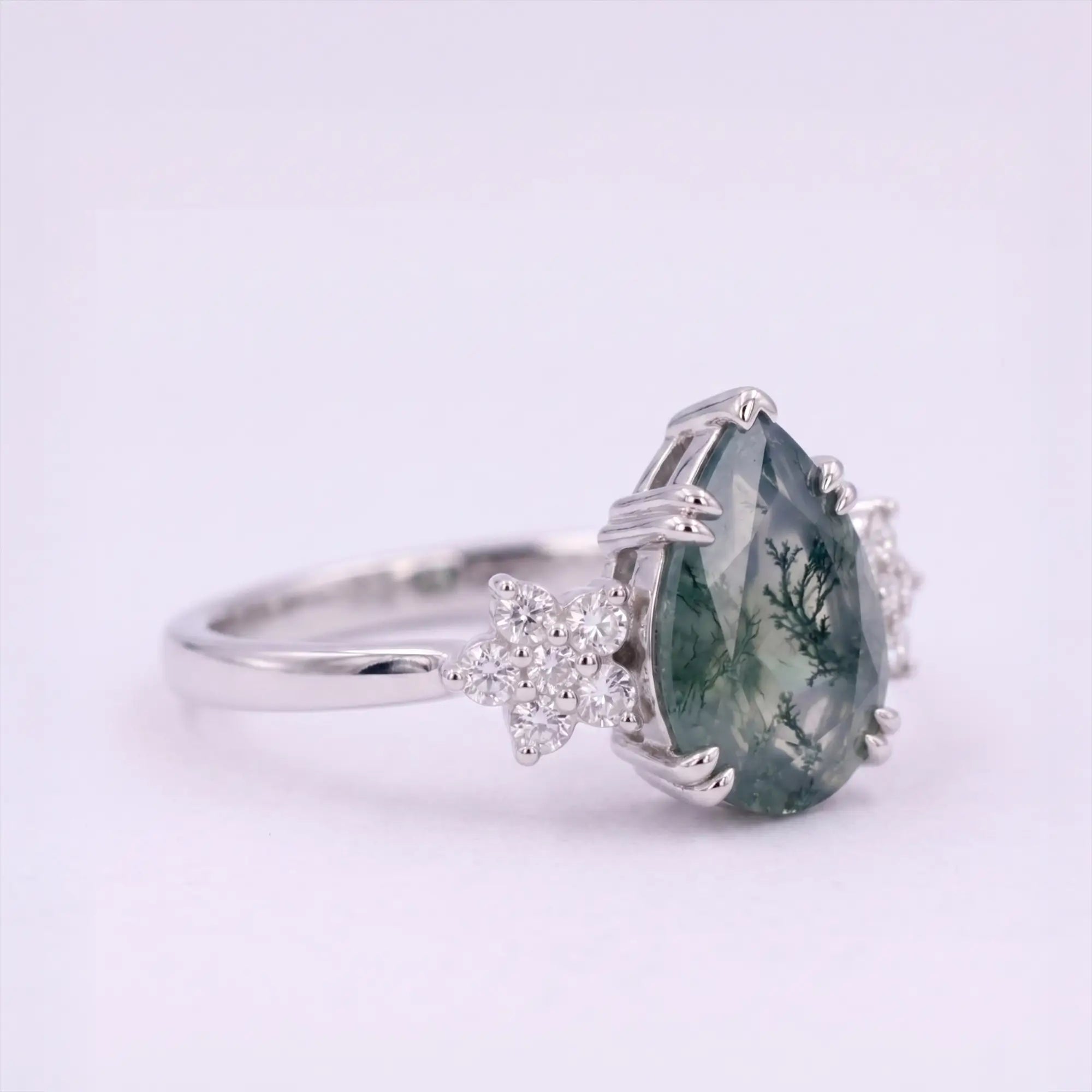 Angled side view of Eldoria engagement ring showing secure prong alignment, protective V-tip, and band durability