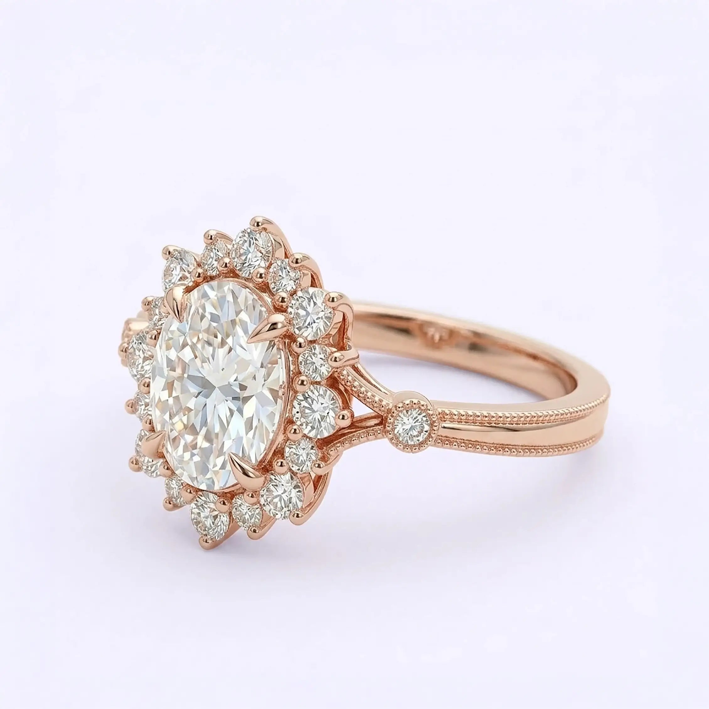 Artisanal gold engagement ring featuring oval moissanite with unique layered halo layout