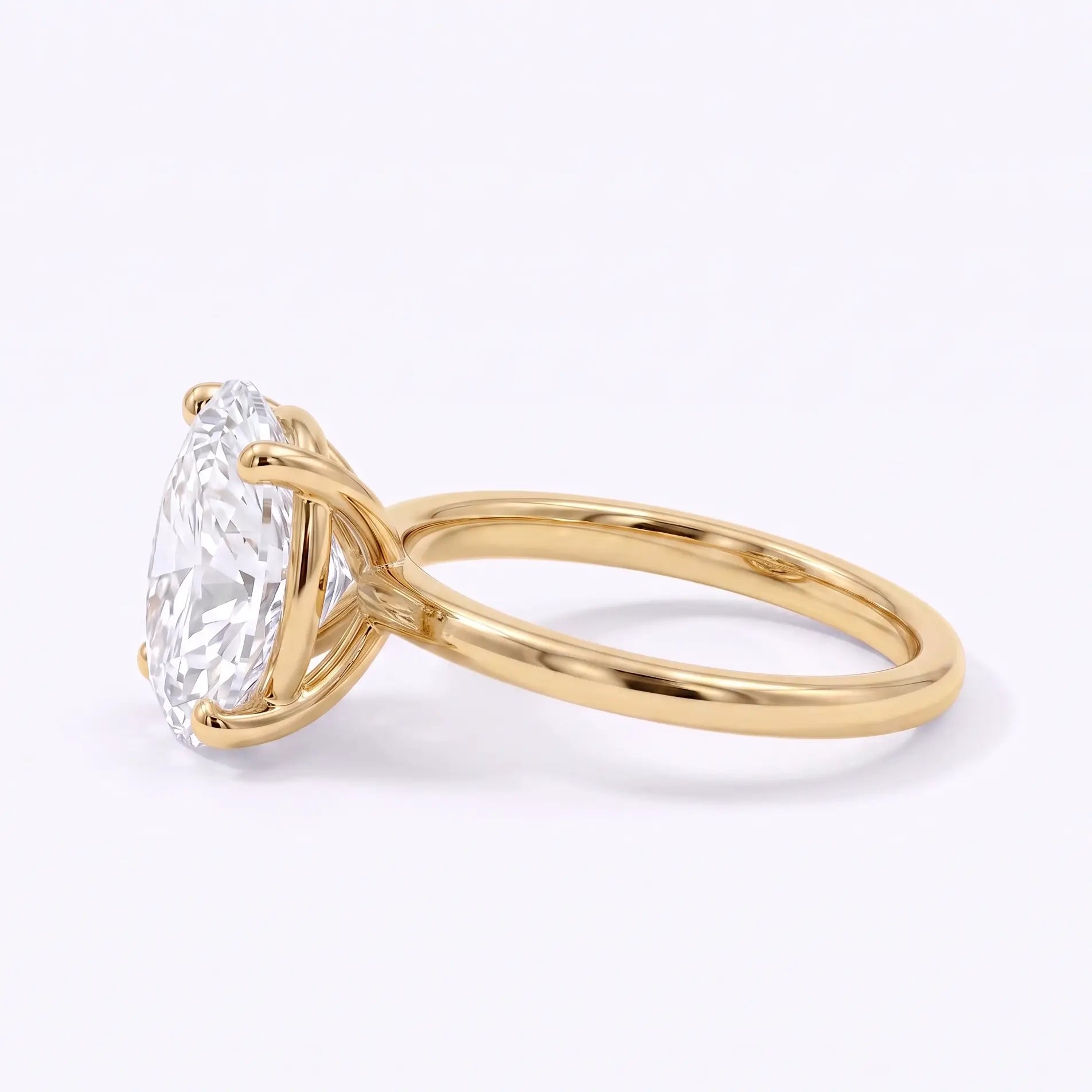 Left view of oval lab diamond solitaire ring with a slim polished gold band