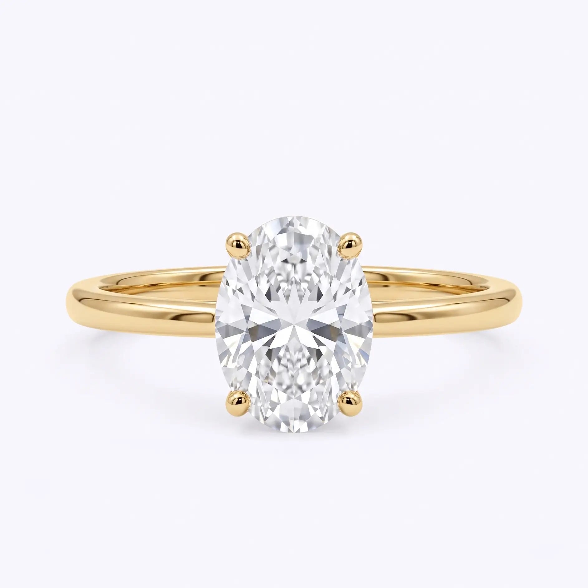 Classic oval lab diamond solitaire engagement ring in yellow gold