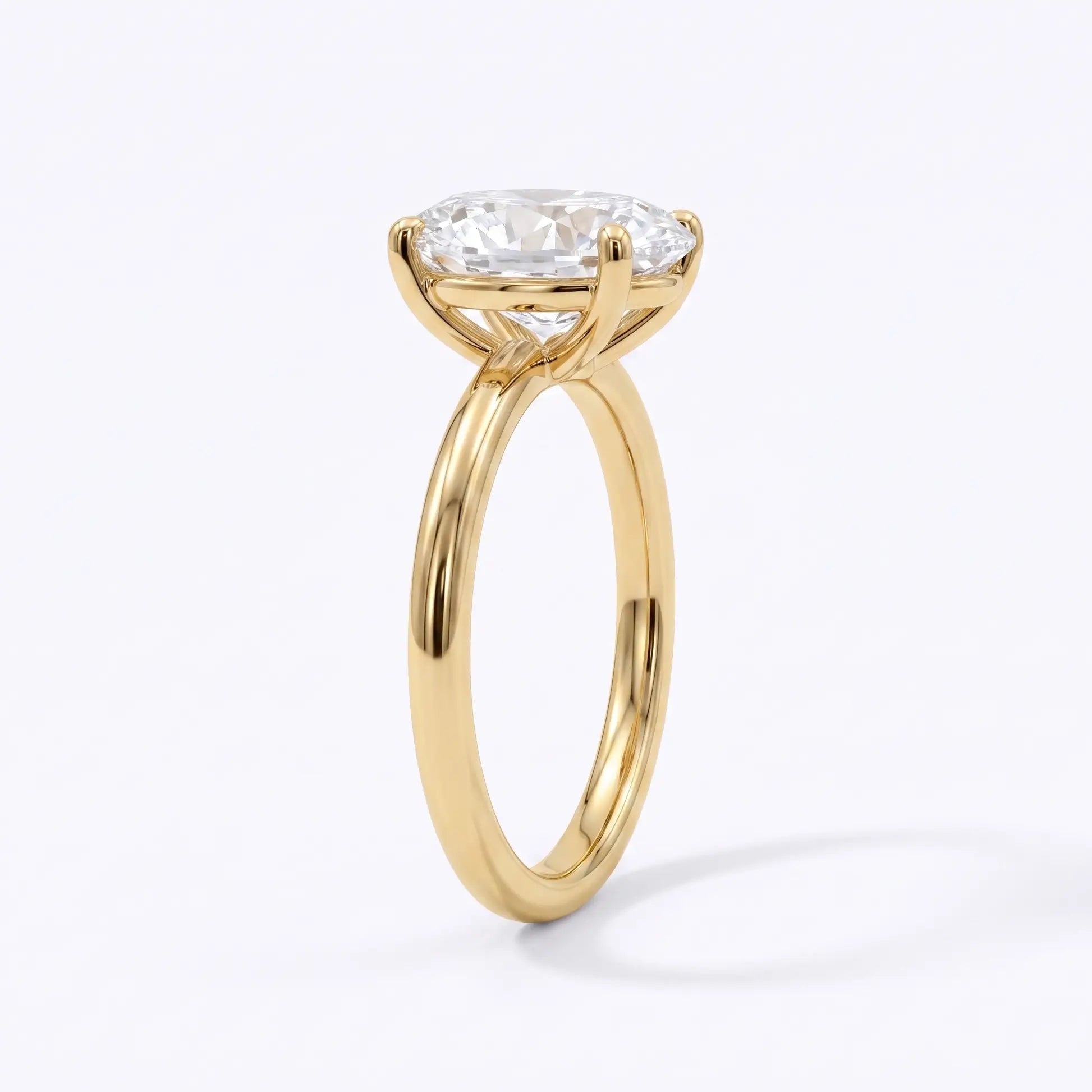 Side profile of classic oval diamond engagement ring showing the solitaire setting