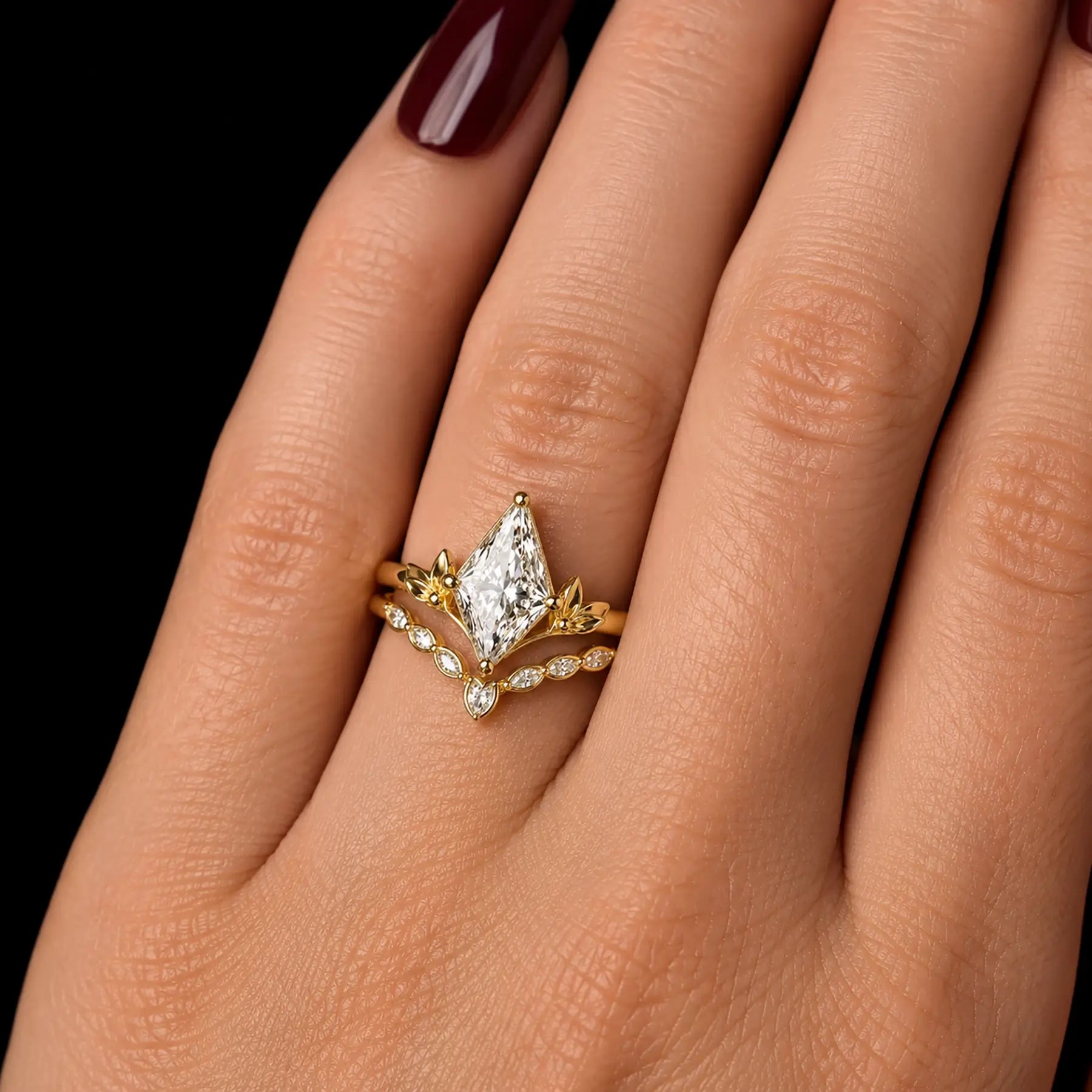 Kite cut moissanite leaf bridal ring set worn on hand with matching contour band