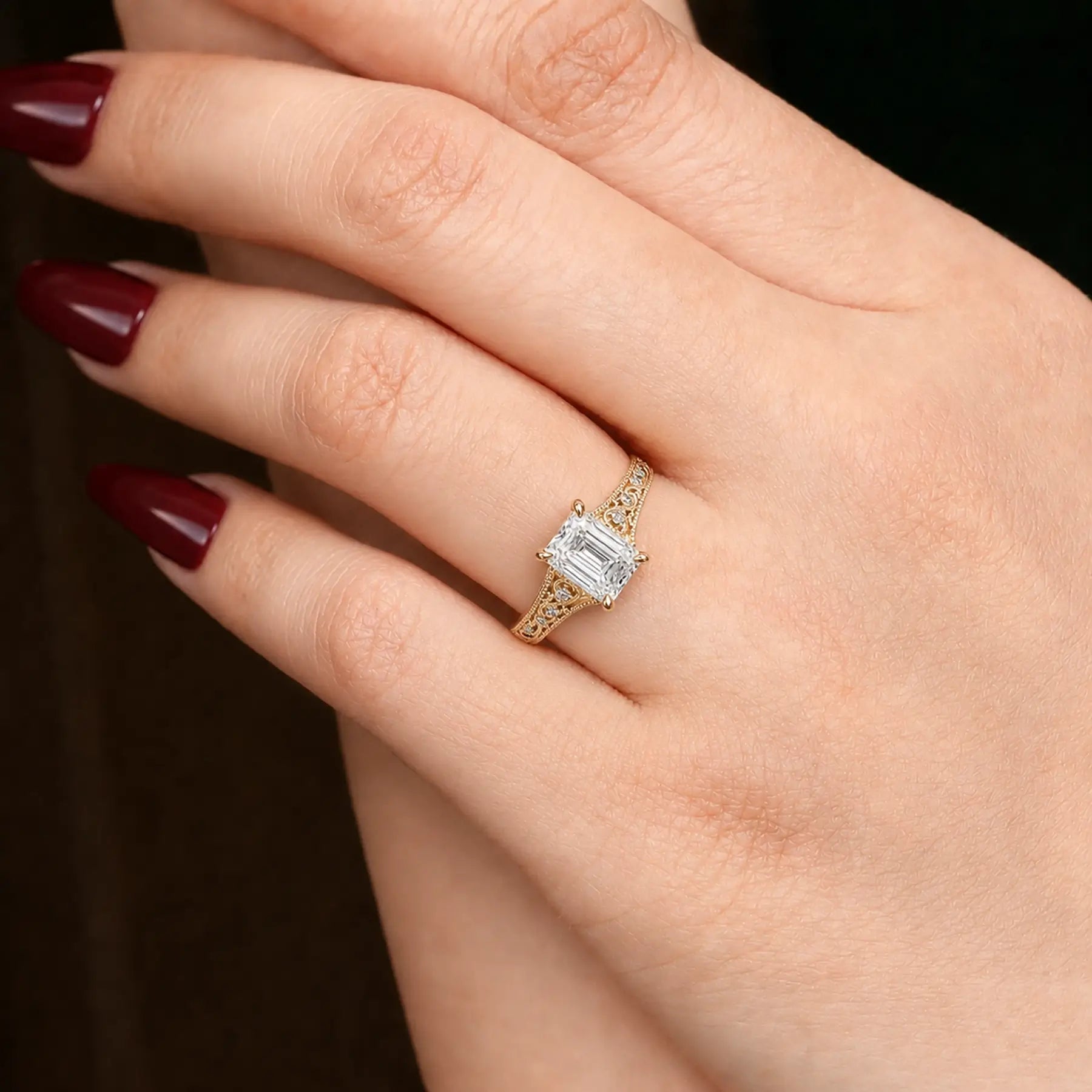 Emerald cut lab diamond filigree ring worn on hand