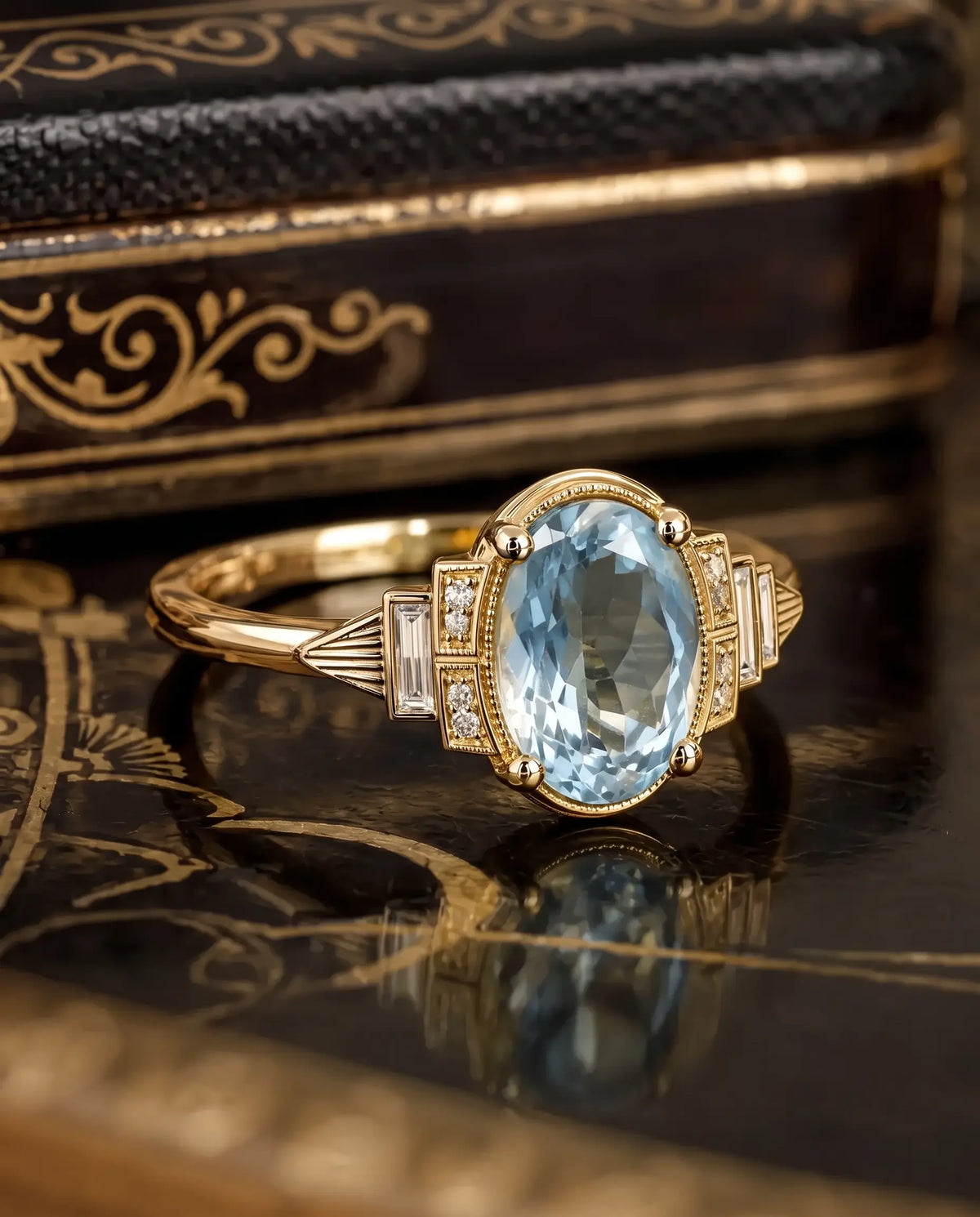 Rectangular step cut moissanite side stones arranged symmetrically beside the oval aquamarine center gemstone