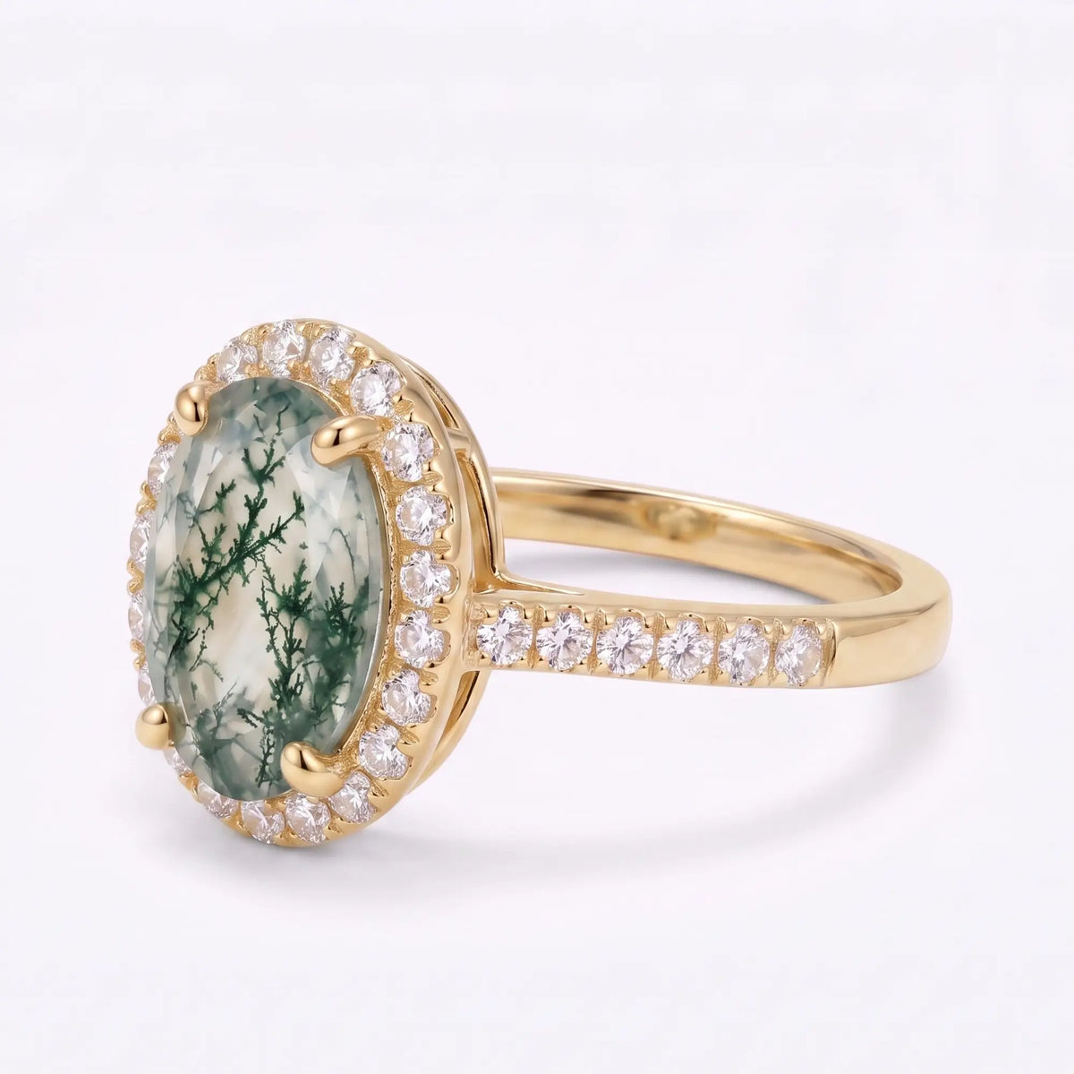 Close-up of round moissanite halo surrounding a natural moss agate center
