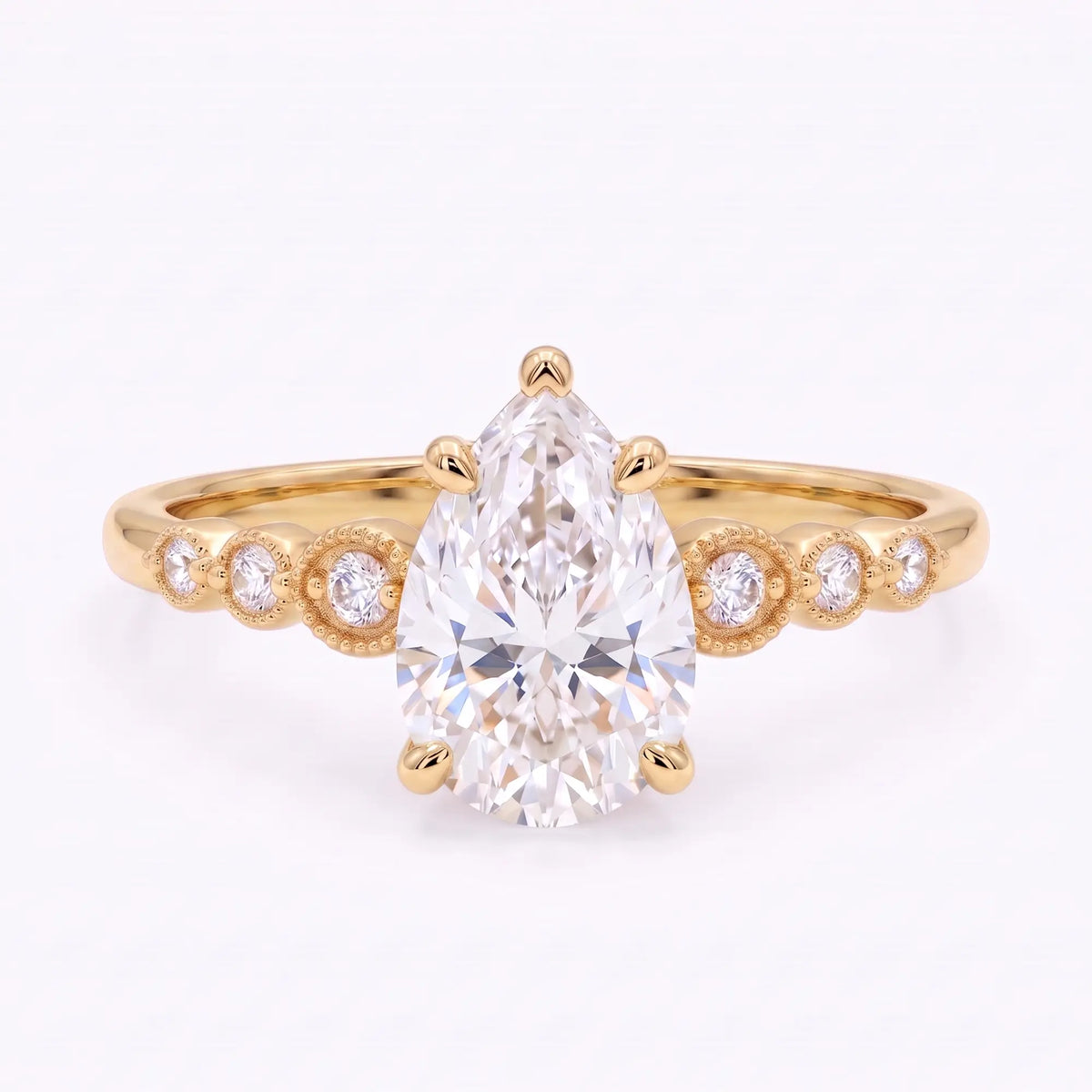 Vintage pear cut moissanite seven stone engagement ring in yellow gold with six round accents