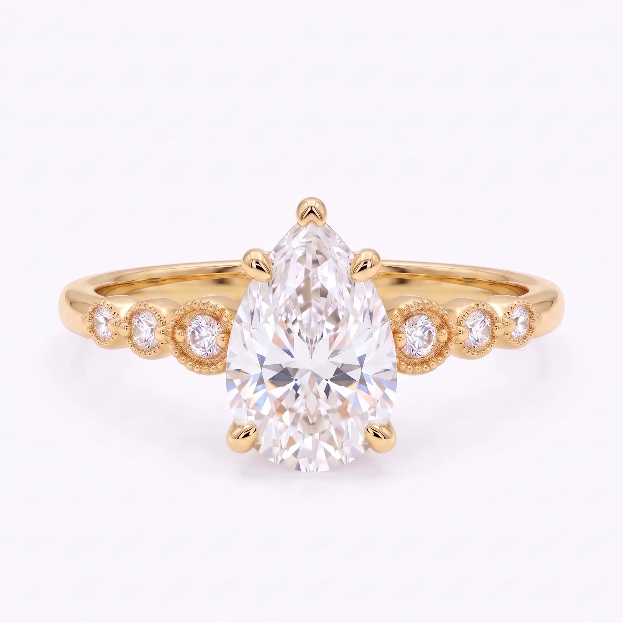 Vintage pear cut moissanite seven stone engagement ring in yellow gold with six round accents