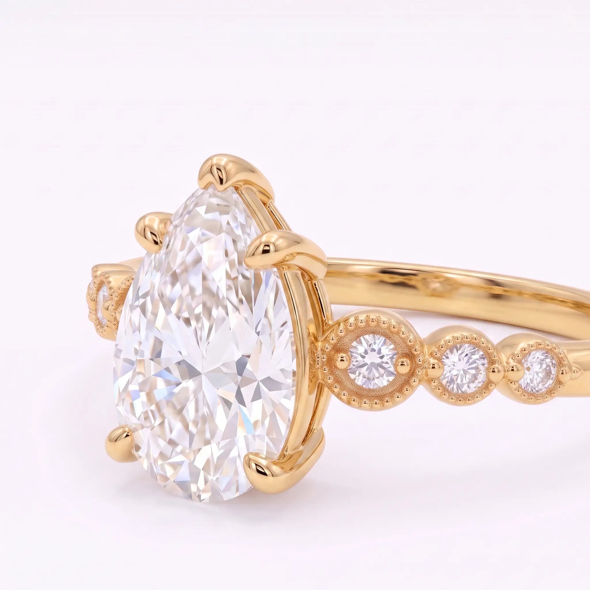 Left view of pear cut moissanite engagement ring with vintage seven-stone design