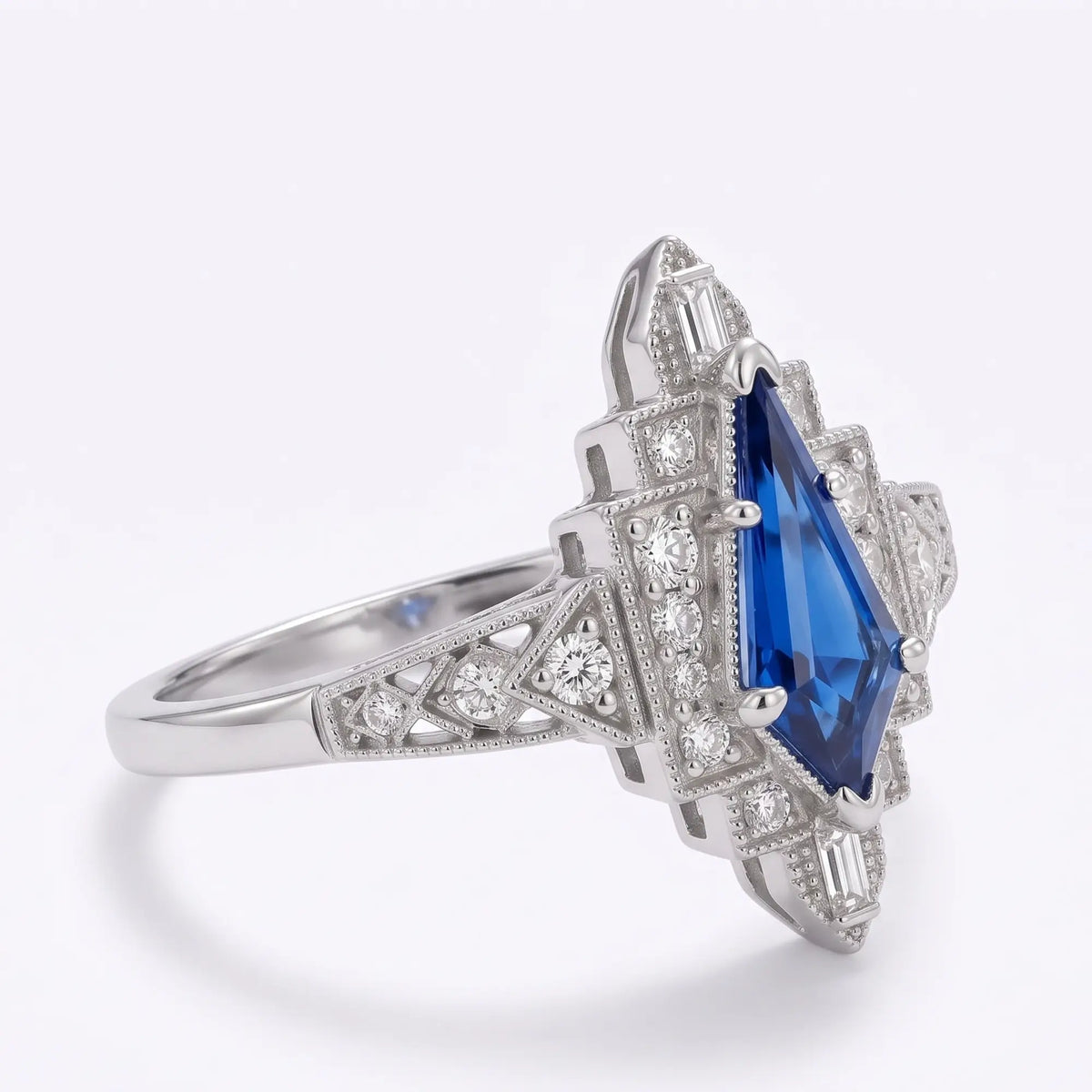 Front view of vintage Art Deco kite cut lab sapphire halo engagement ring