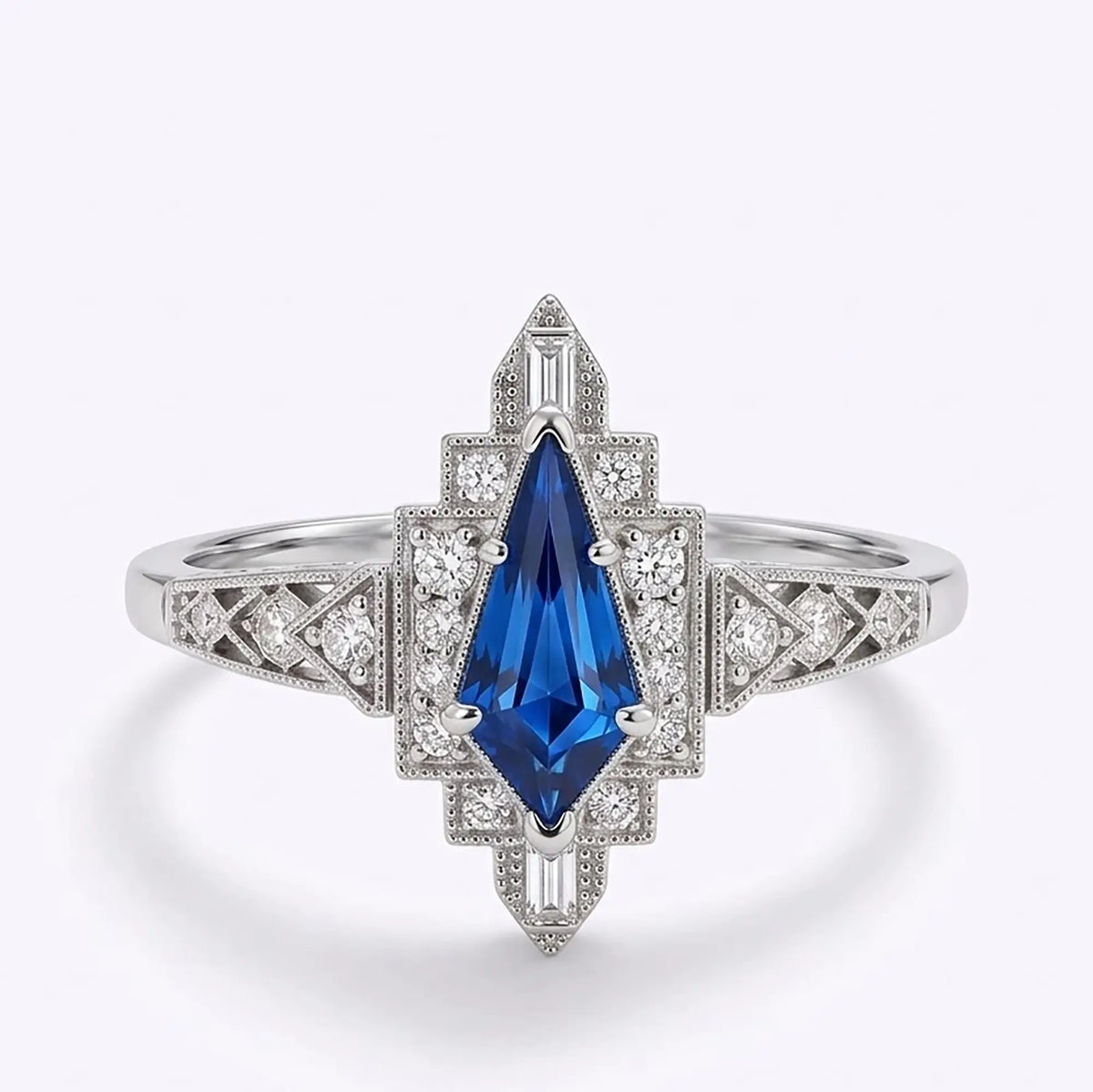 Vintage Art Deco kite cut lab sapphire halo engagement ring with round and rectangular moissanite accents in white gold