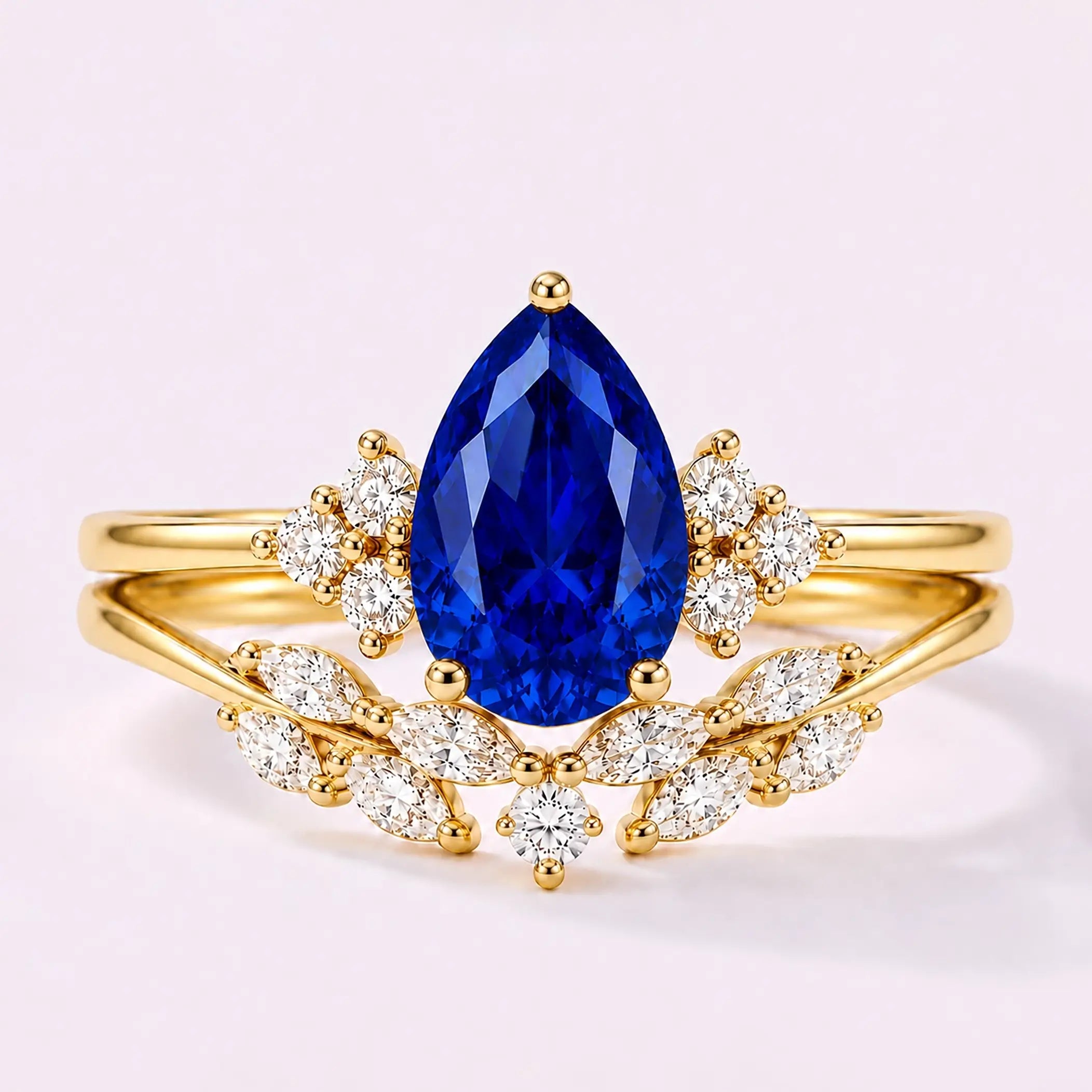Pear cut sapphire cluster bridal ring set with marquise wedding band in yellow gold