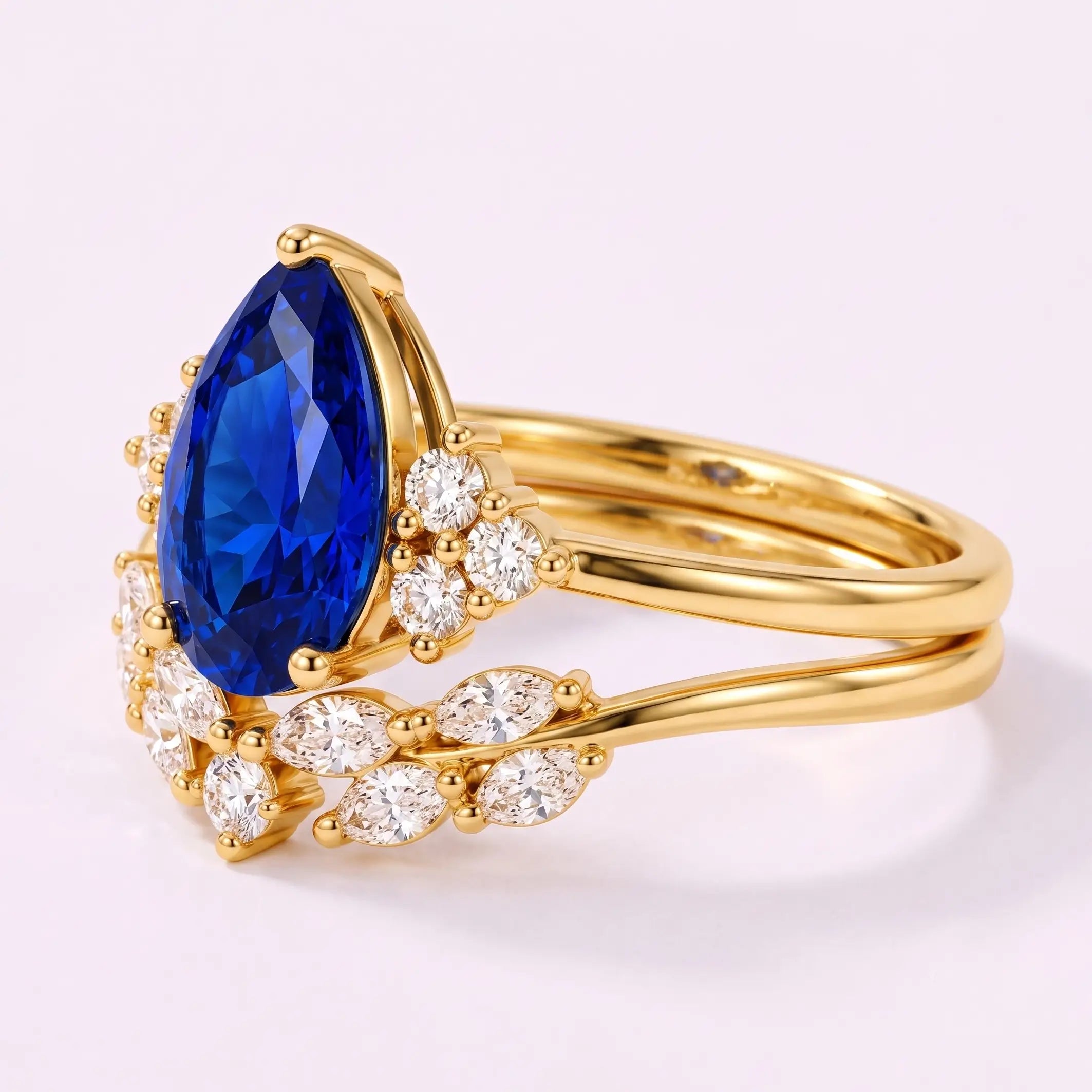 Side view of sapphire bridal ring set showing layered gold band design