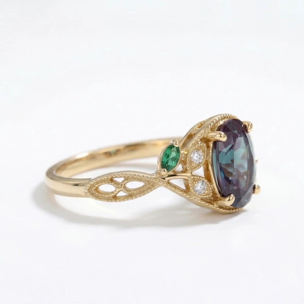 edwardian emerald engagement ring with vintage leaf band and moissanite accents in gold