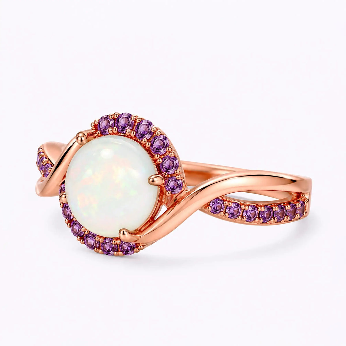 Left view of round opal ring with amethyst halo and flowing band design
