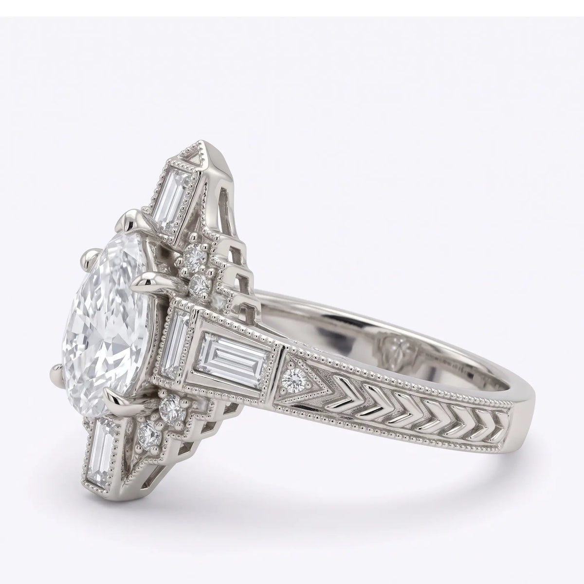 Front view of vintage Art Deco pear moissanite halo engagement ring with geometric stepped design