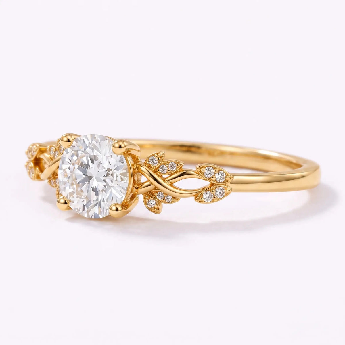 Close-up view of botanical leaf details on a round lab diamond engagement ring