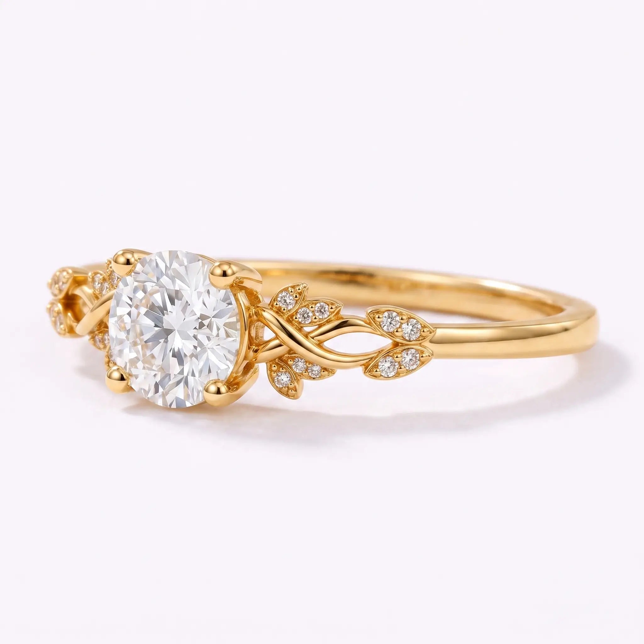 Close-up view of botanical leaf details on a round lab diamond engagement ring