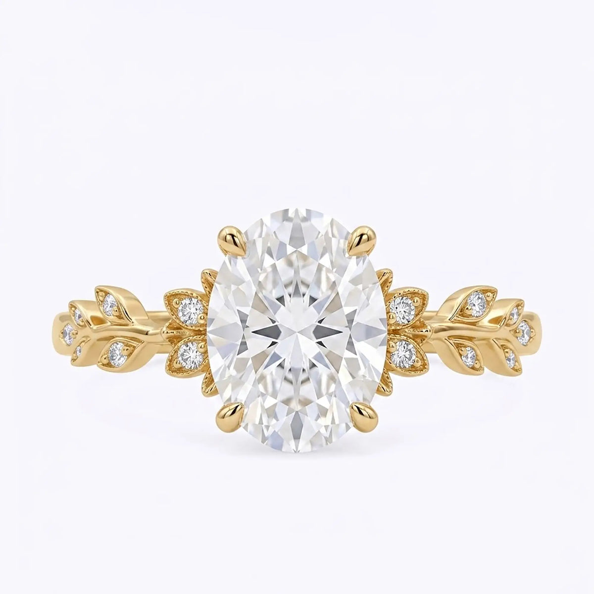 Oval moissanite nature inspired leaf engagement ring in yellow gold