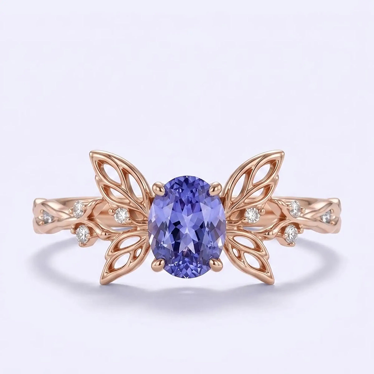 Oval lab sapphire butterfly engagement ring in rose gold