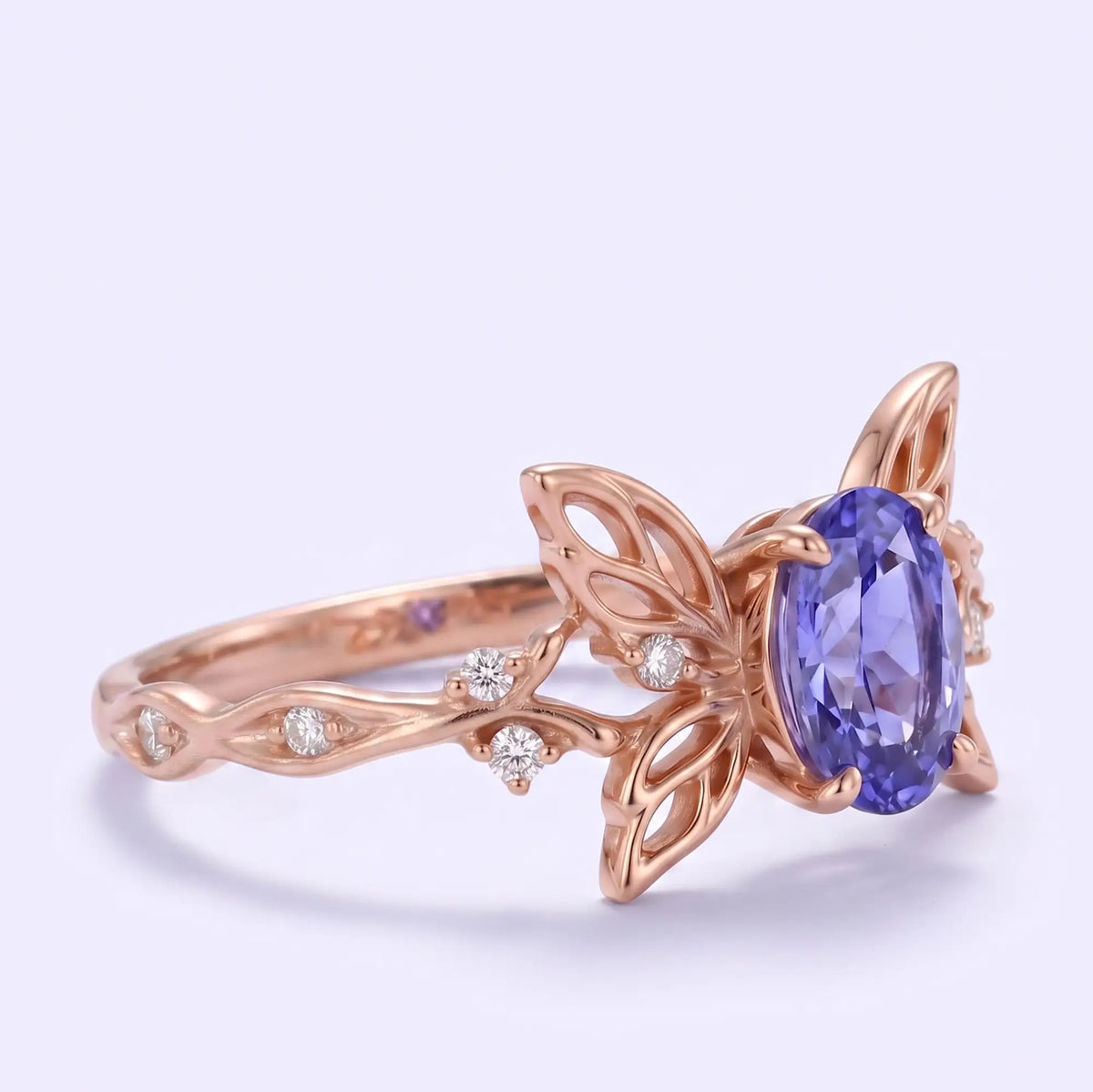 Nature inspired butterfly ring with violet blue oval lab sapphire