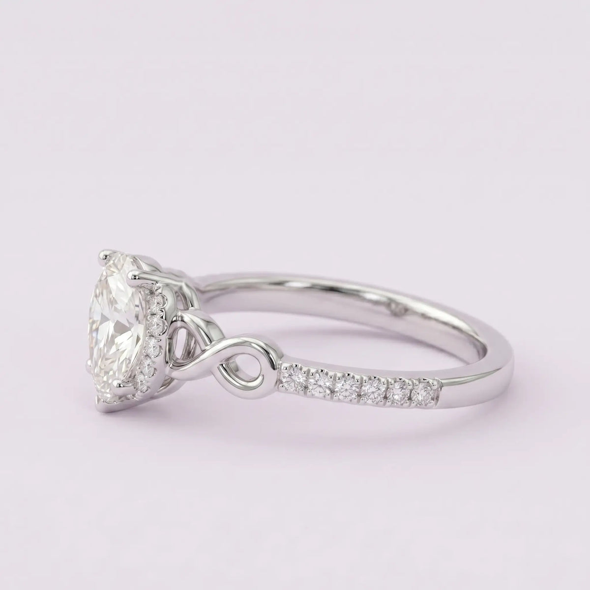 Angled side view of Elysia engagement ring showing secure prong alignment, protective V-tip apex, and band durability