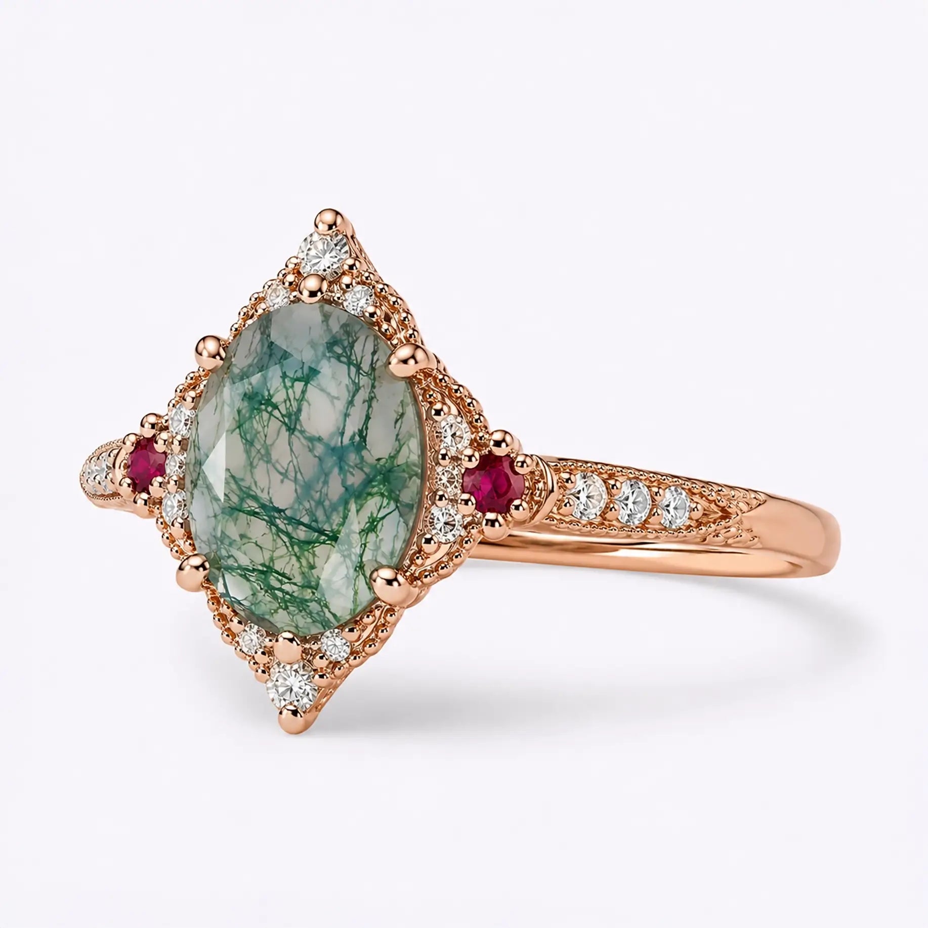 Left view of oval moss agate ring showing vintage halo setting and gemstone details