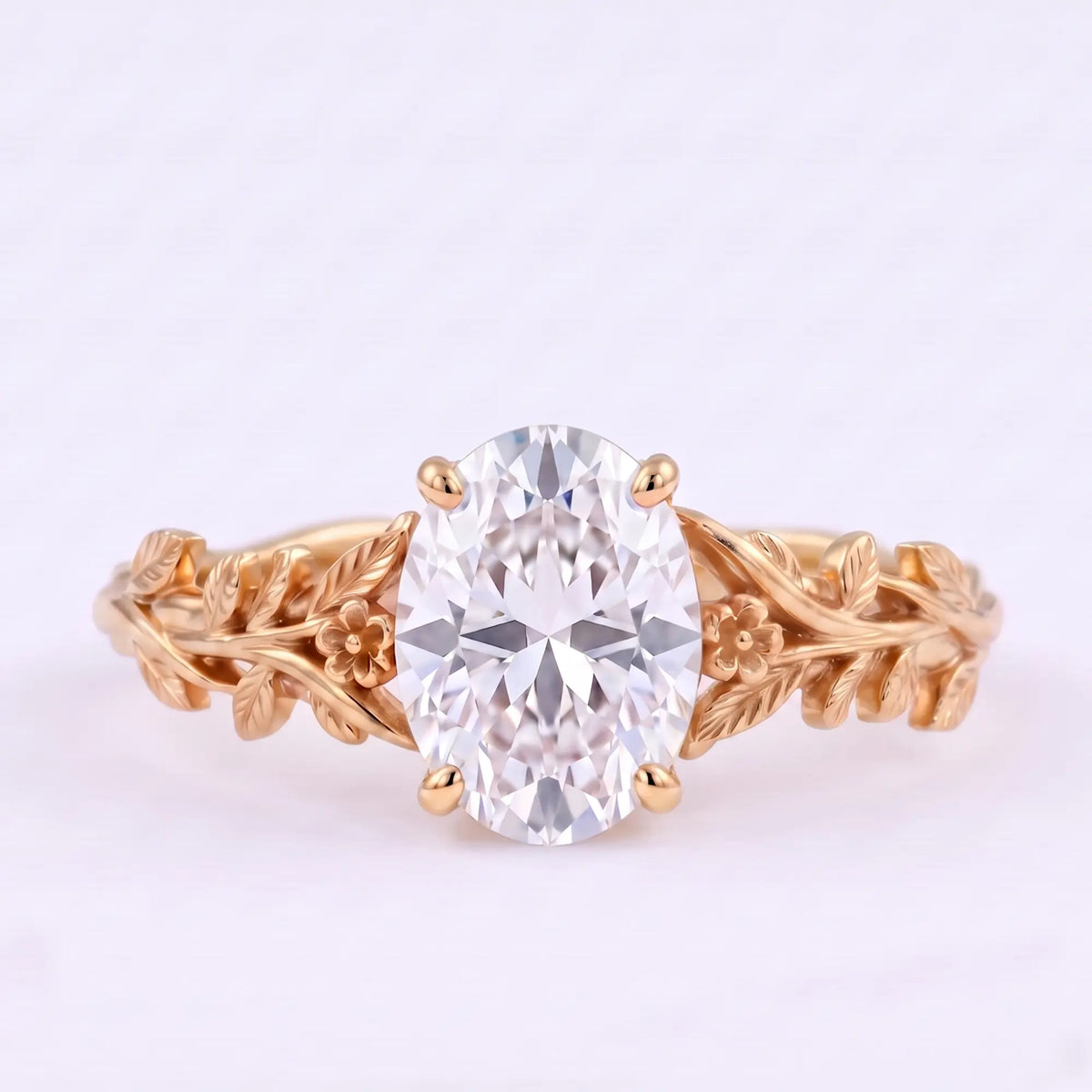 Oval moissanite botanical solitaire engagement ring with floral vine band in rose gold