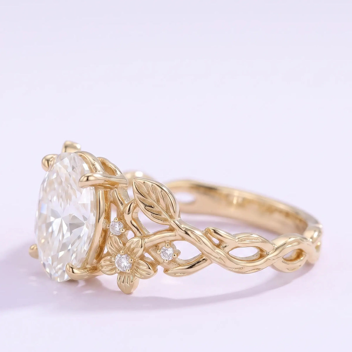 Nature inspired oval moissanite ring with flower and leaf details